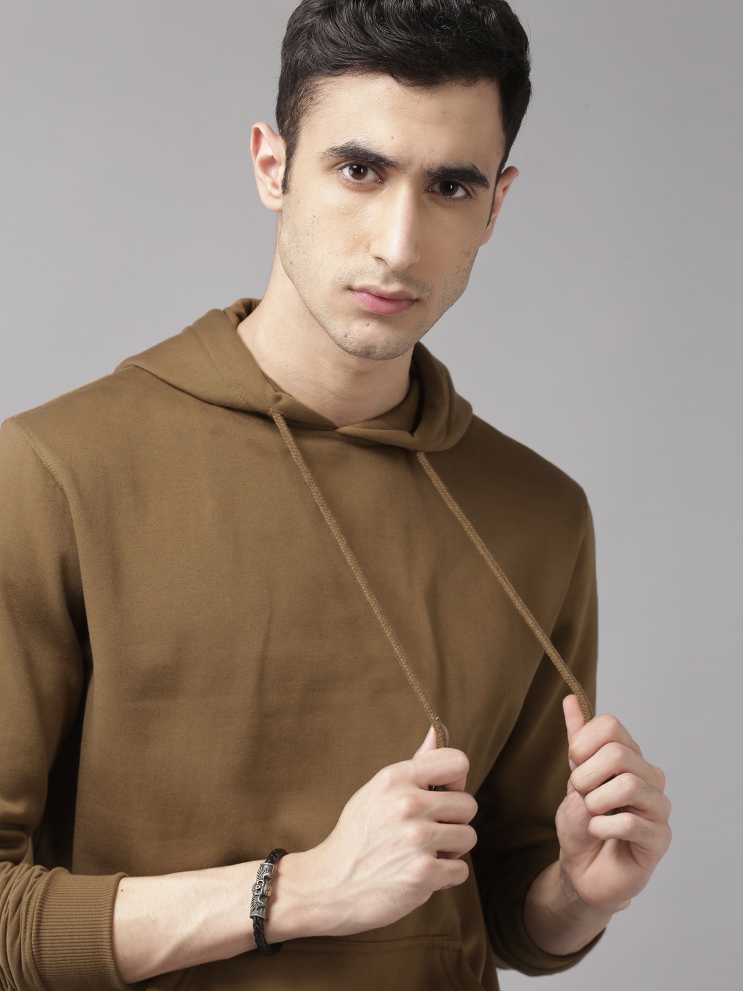 

Roadster Men Brown Solid Hooded Sweatshirt