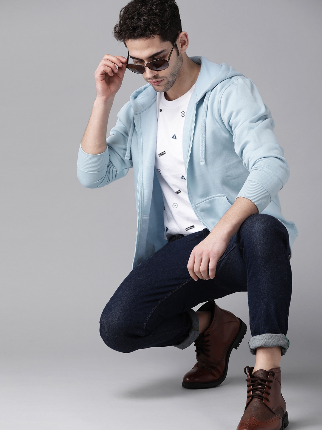 

Roadster Men Blue Solid Hooded Sweatshirt
