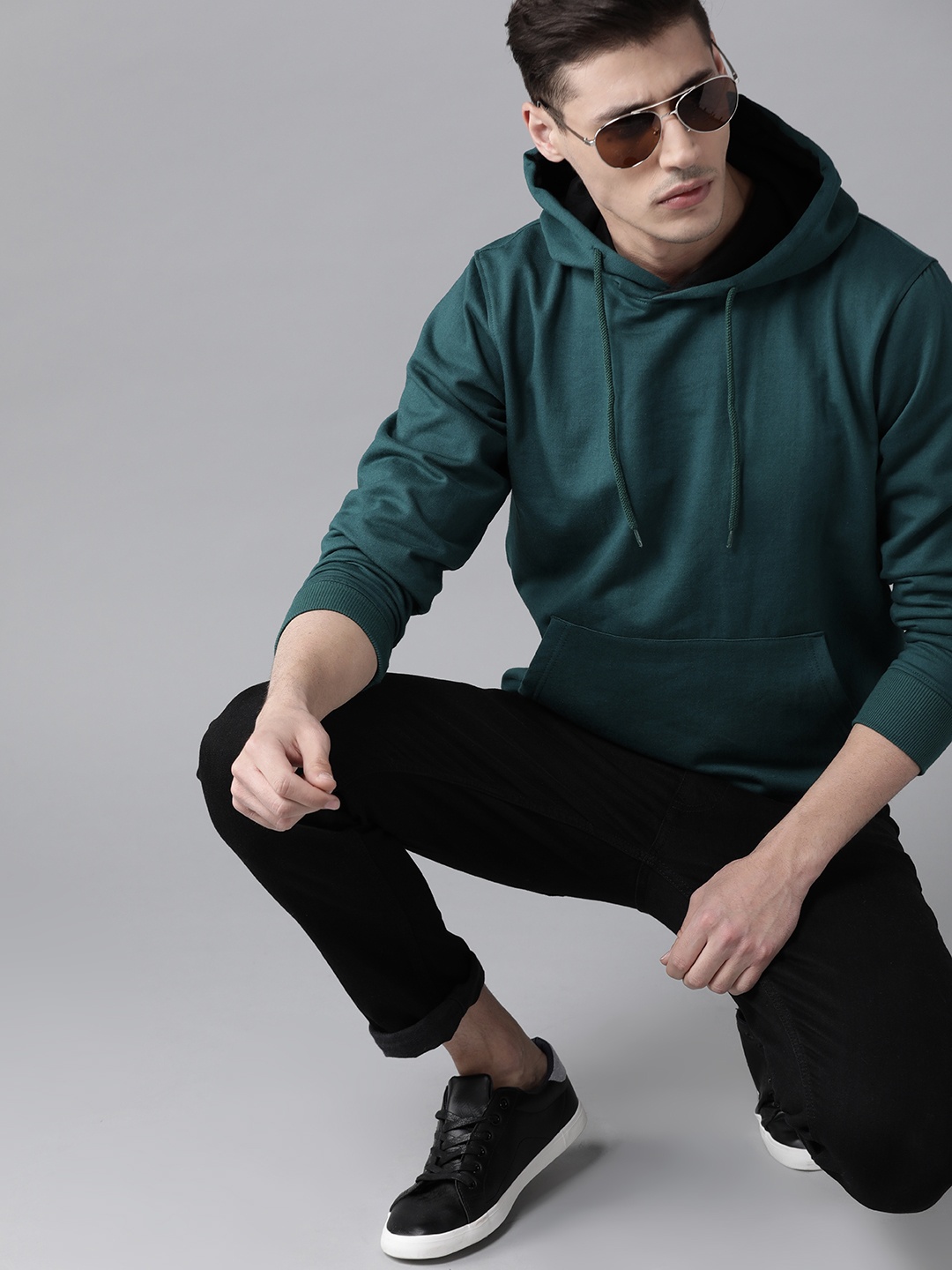 

Roadster Men Green Solid Hooded Sweatshirt