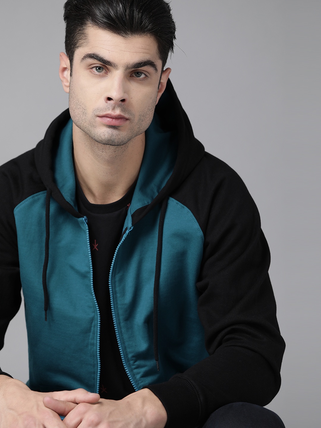 

Roadster Men Teal Blue & Black Solid Hooded Sweatshirt