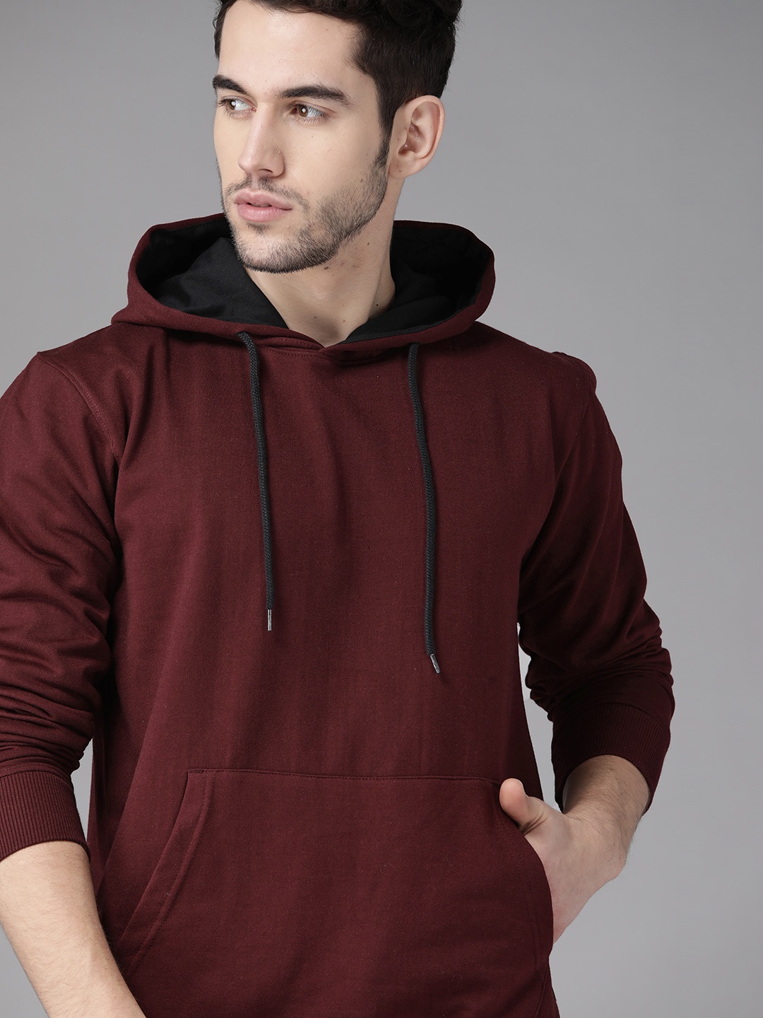 

Roadster Men Burgundy Solid Hooded Sweatshirt
