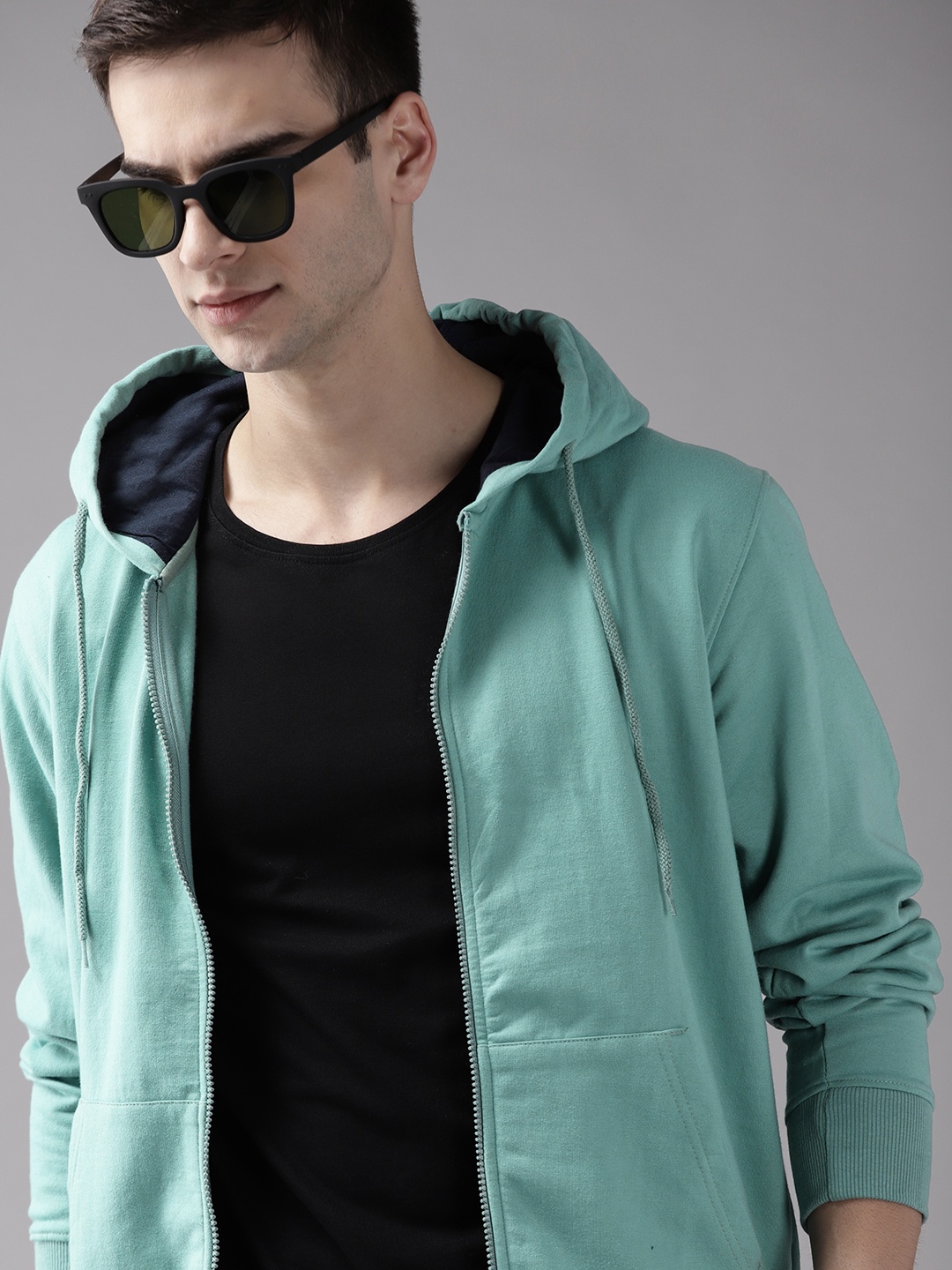 

Roadster Men Blue Solid Hooded Sweatshirt