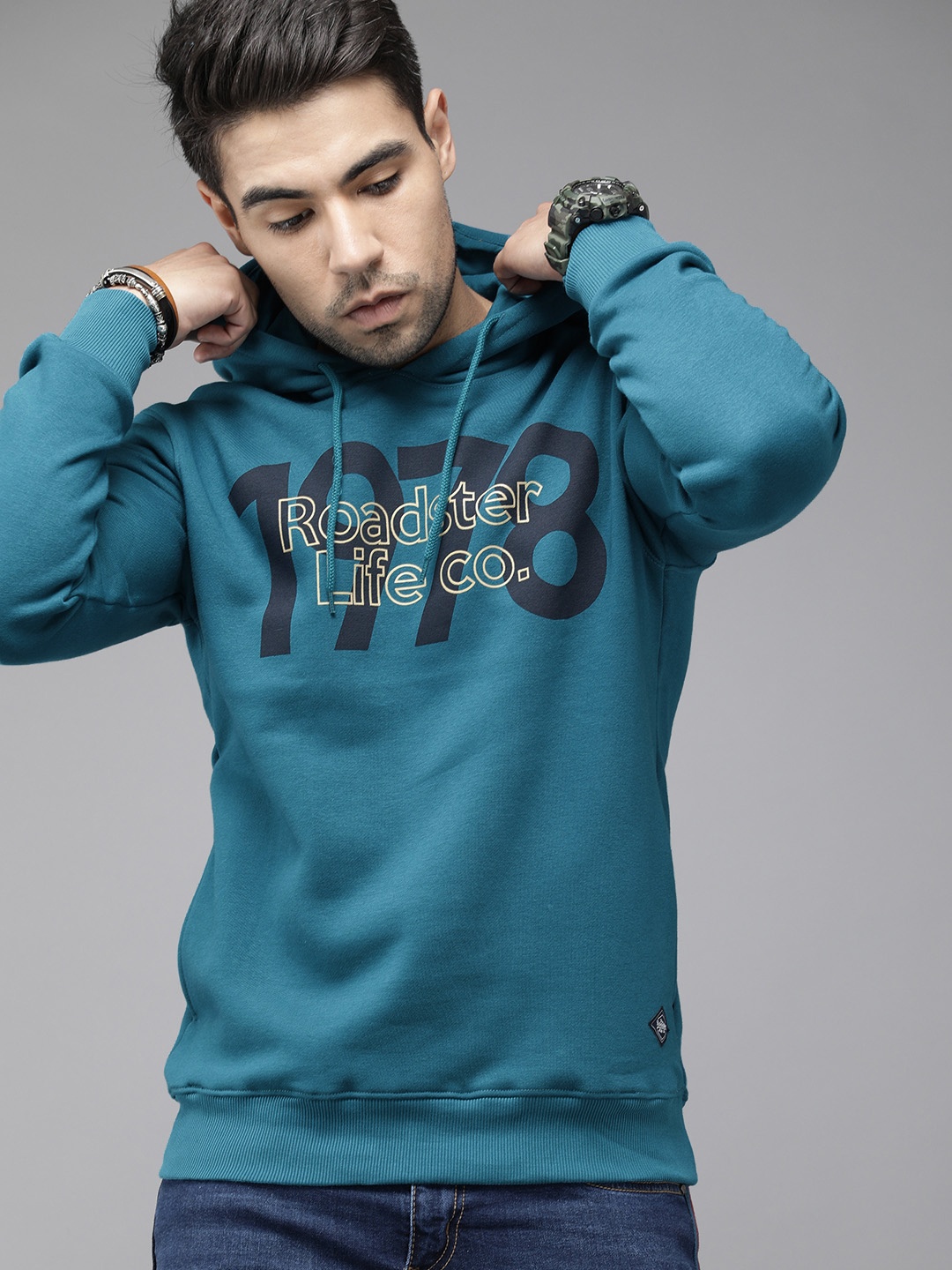 

Roadster Men Teal Blue Printed Hooded Sweatshirt