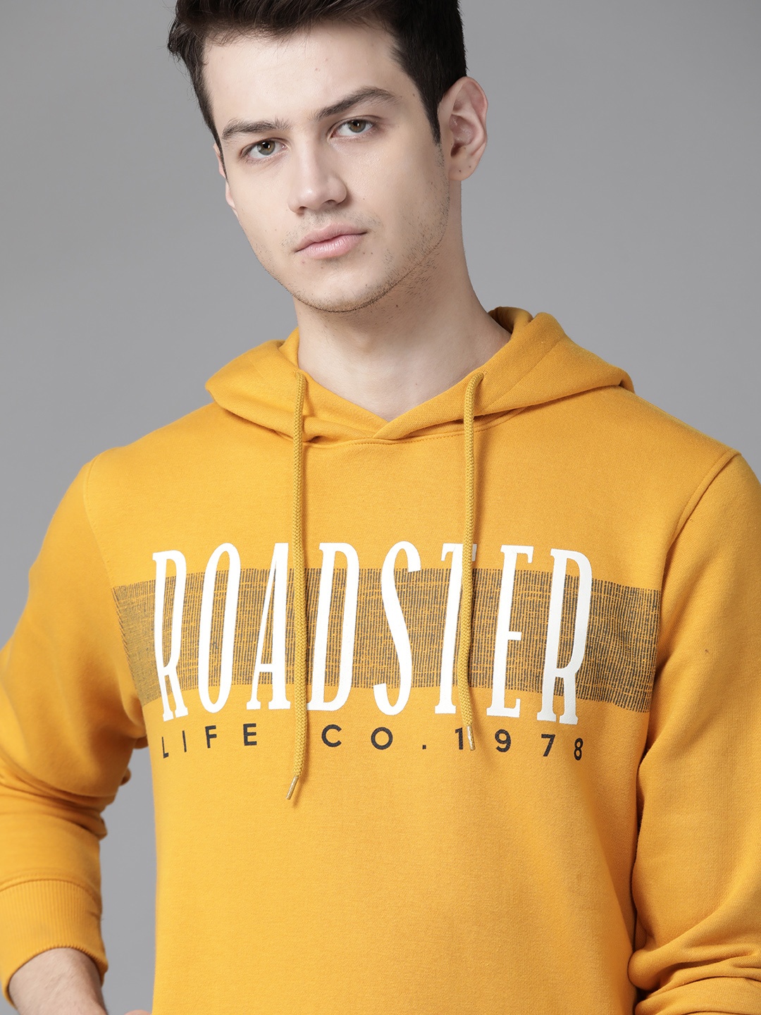 

Roadster Men Mustard Yellow Brand Logo Printed Hooded Sweatshirt
