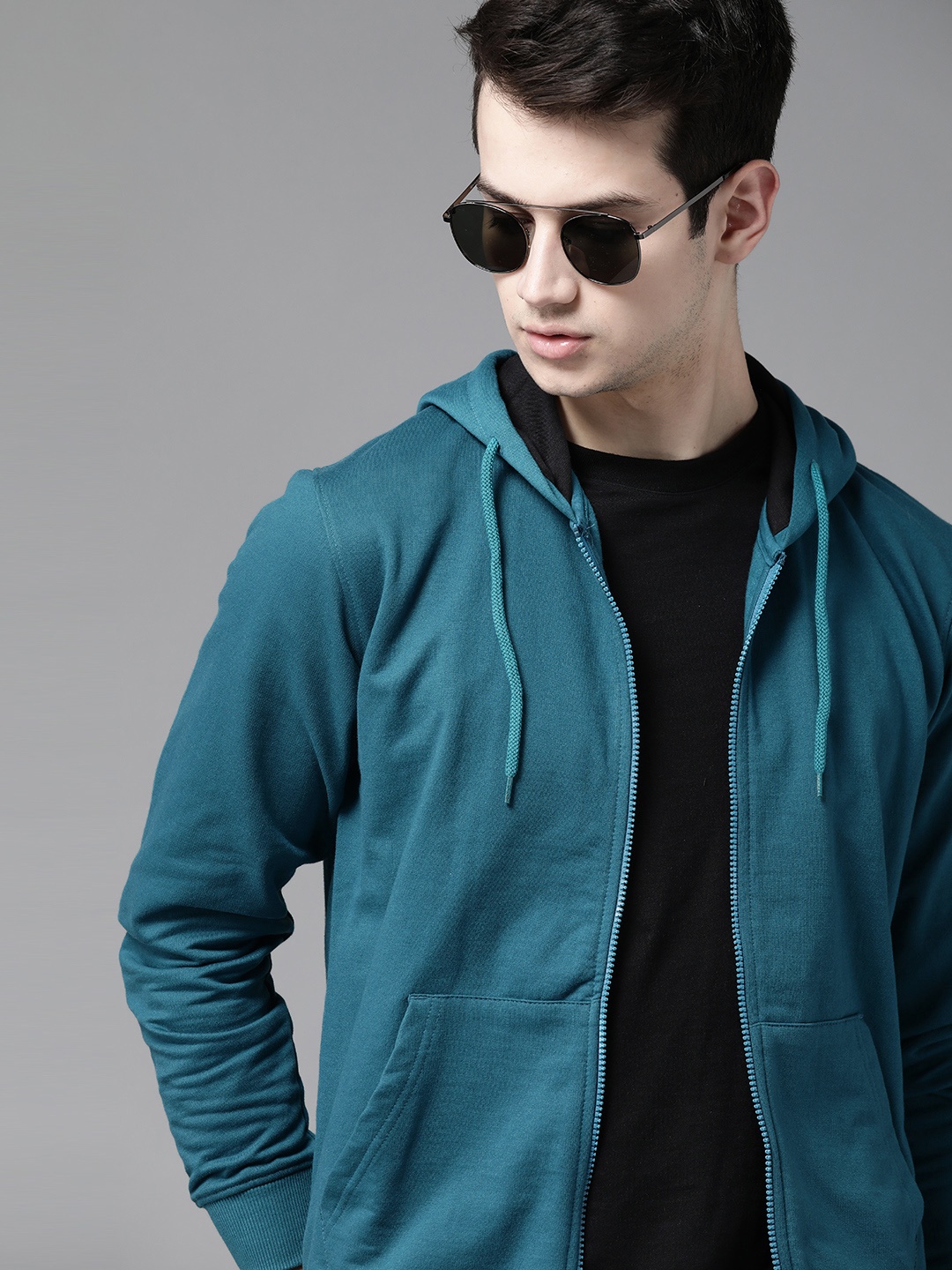 

Roadster Men Teal Blue Solid Hooded Sweatshirt