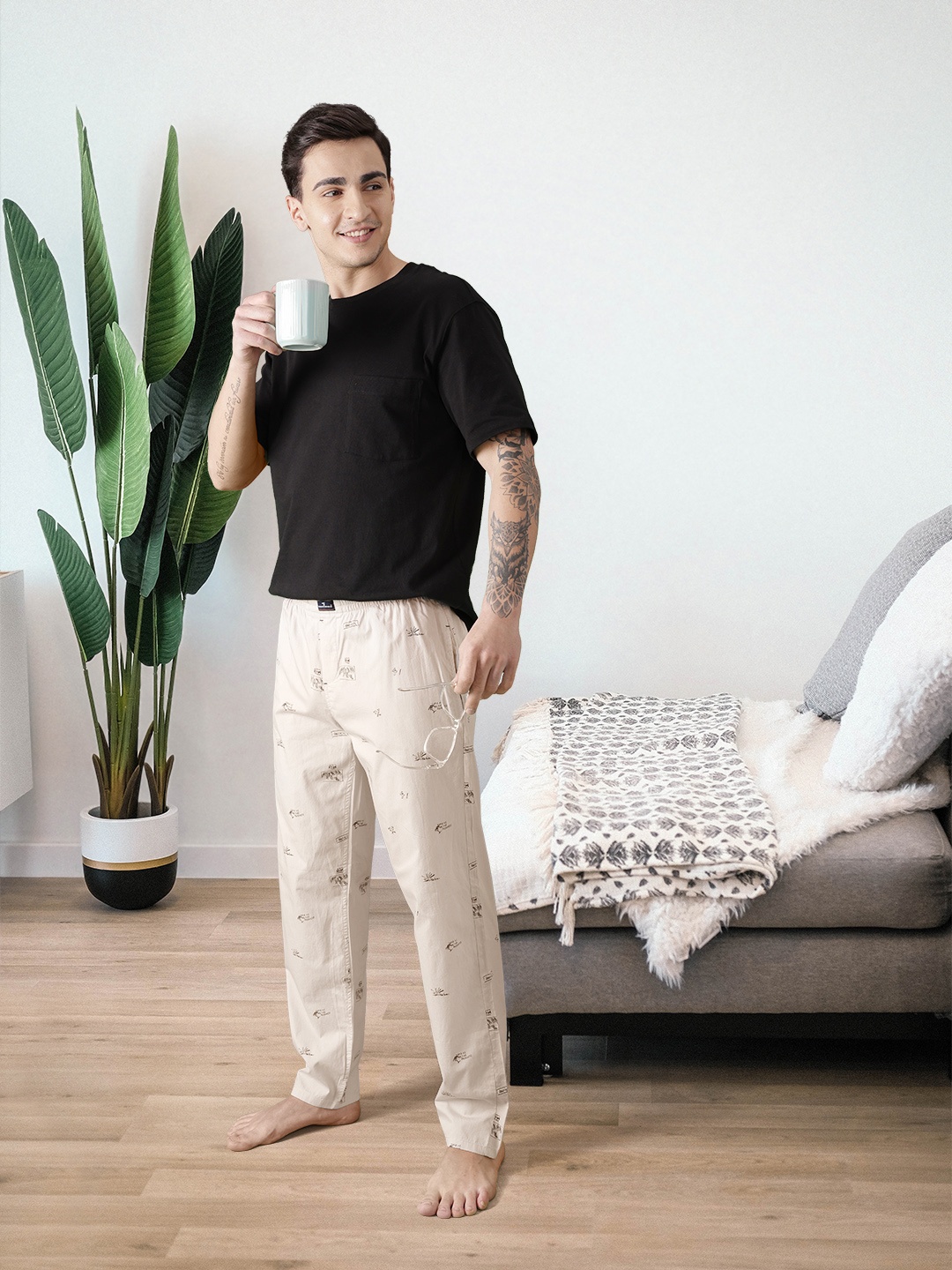 

The Indian Garage Co Men Beige and Black Printed Lounge Pants
