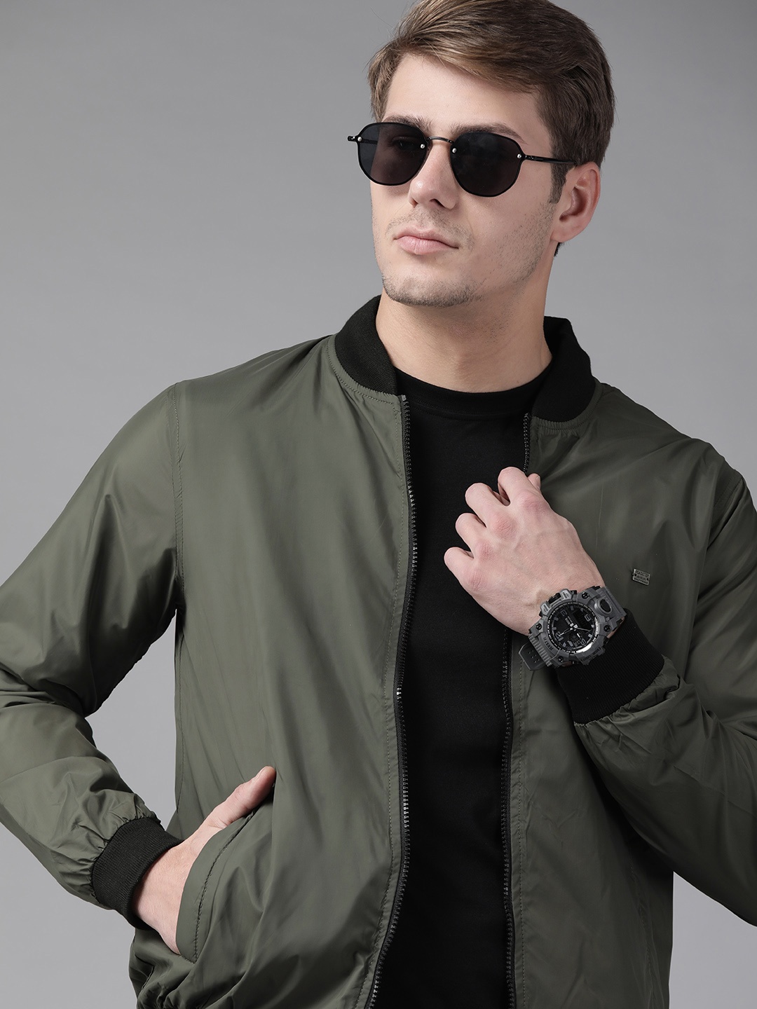 

Roadster Men Olive Green Solid Bomber Jacket