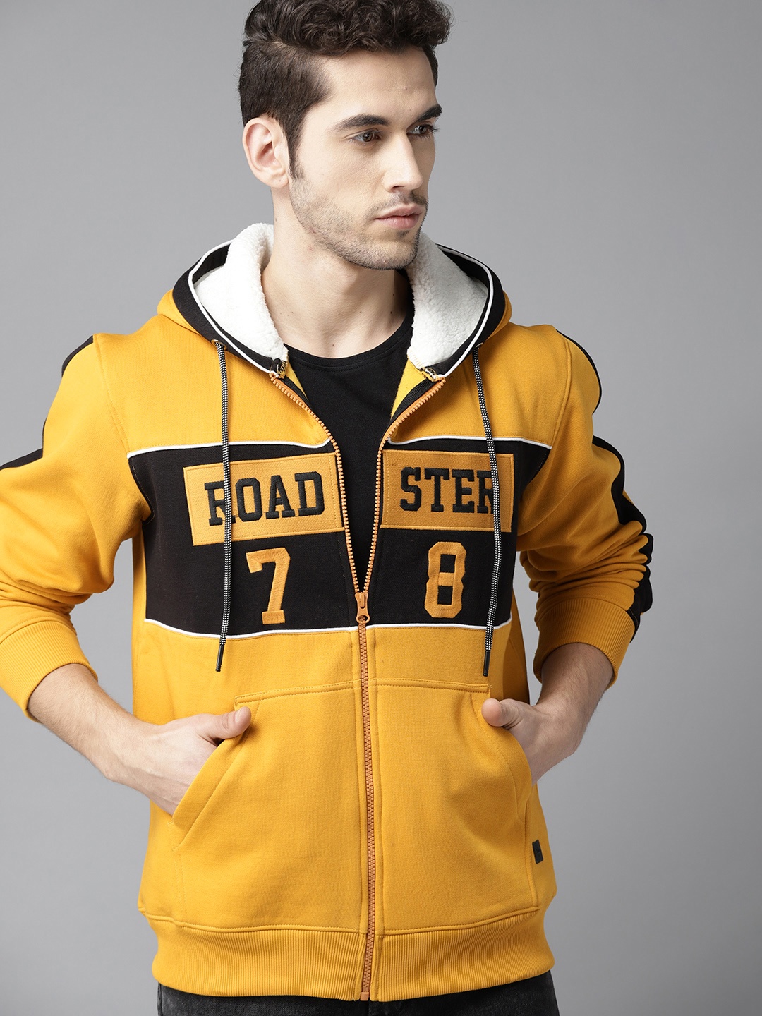 

Roadster Men Mustard Yellow & Black Self Design Hooded Sweatshirt