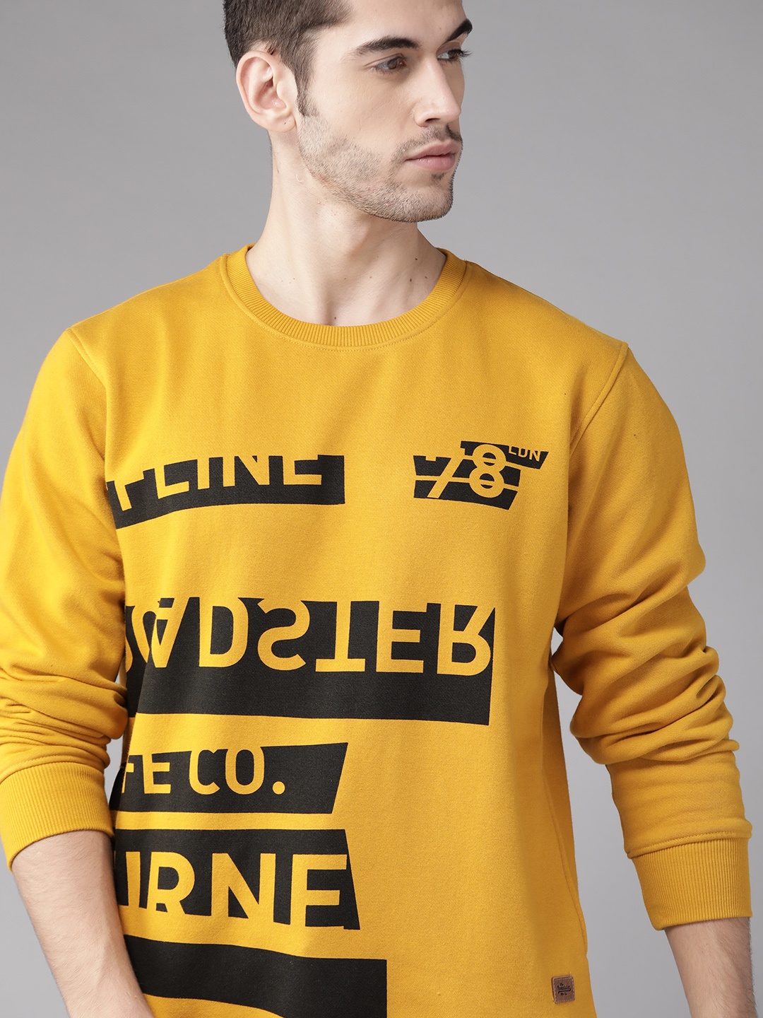 

Roadster Men Mustard Yellow & Black Printed Sweatshirt
