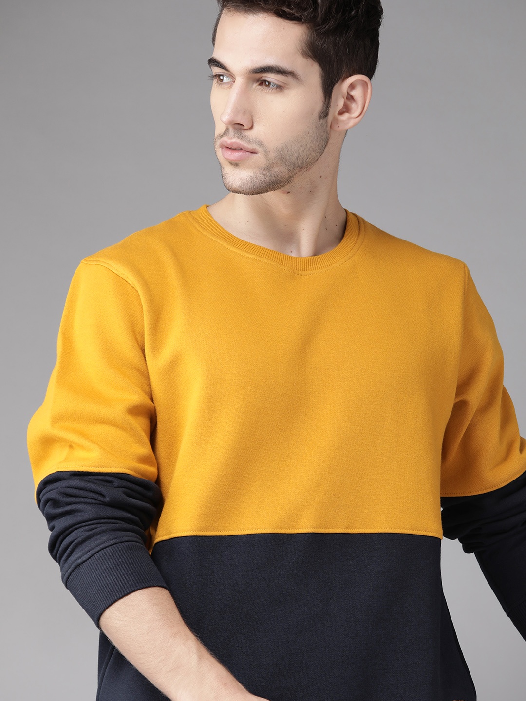 

Roadster Men Mustard Yellow & Navy Blue Colourblocked Sweatshirt