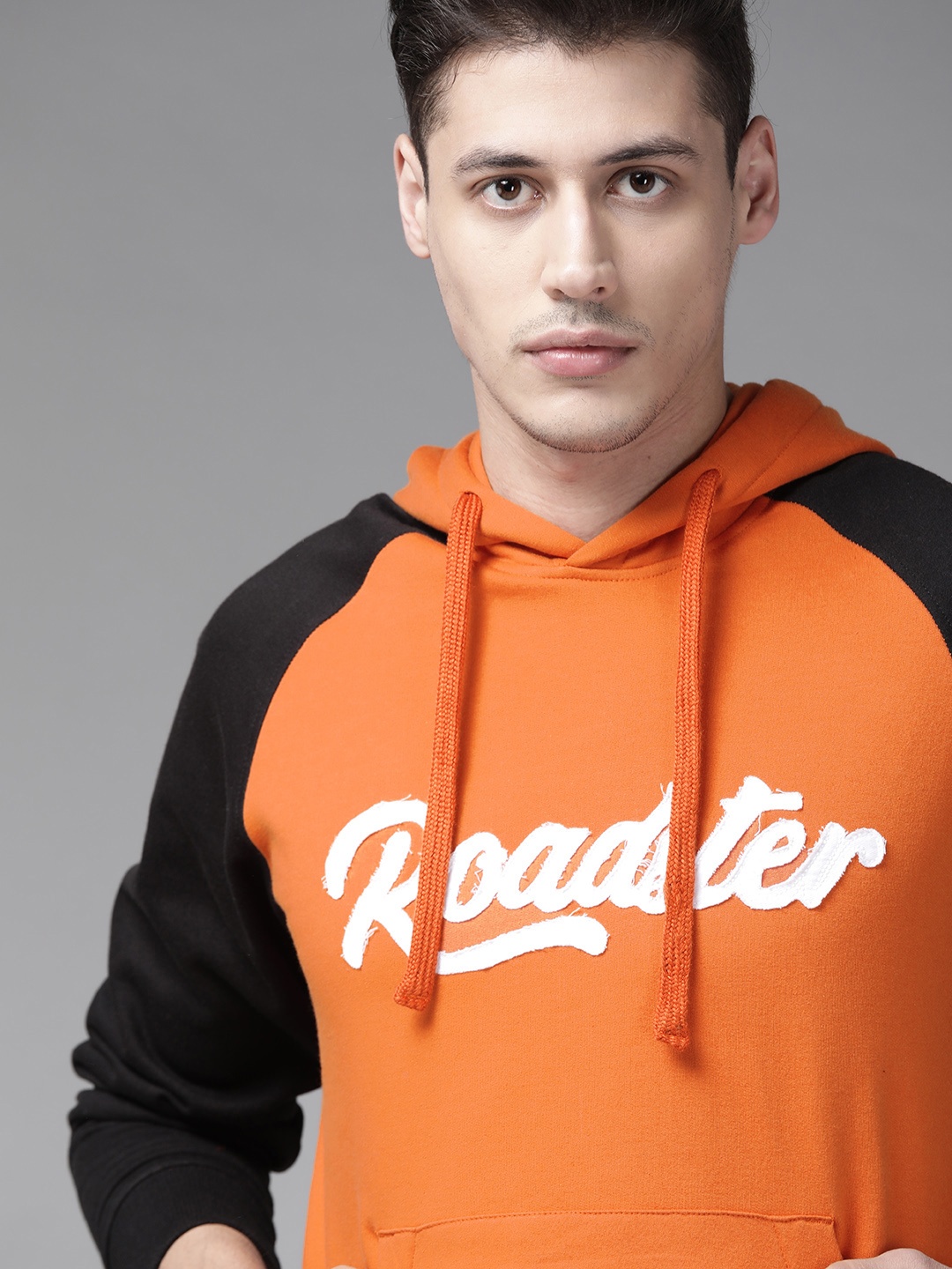 

Roadster Men Orange & Black Solid Hooded Sweatshirt