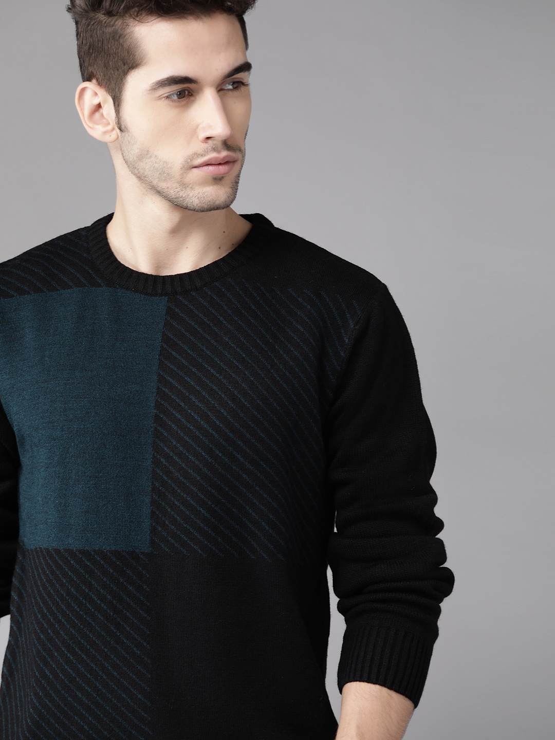 

Roadster Men Black & Blue Self Striped Sweater