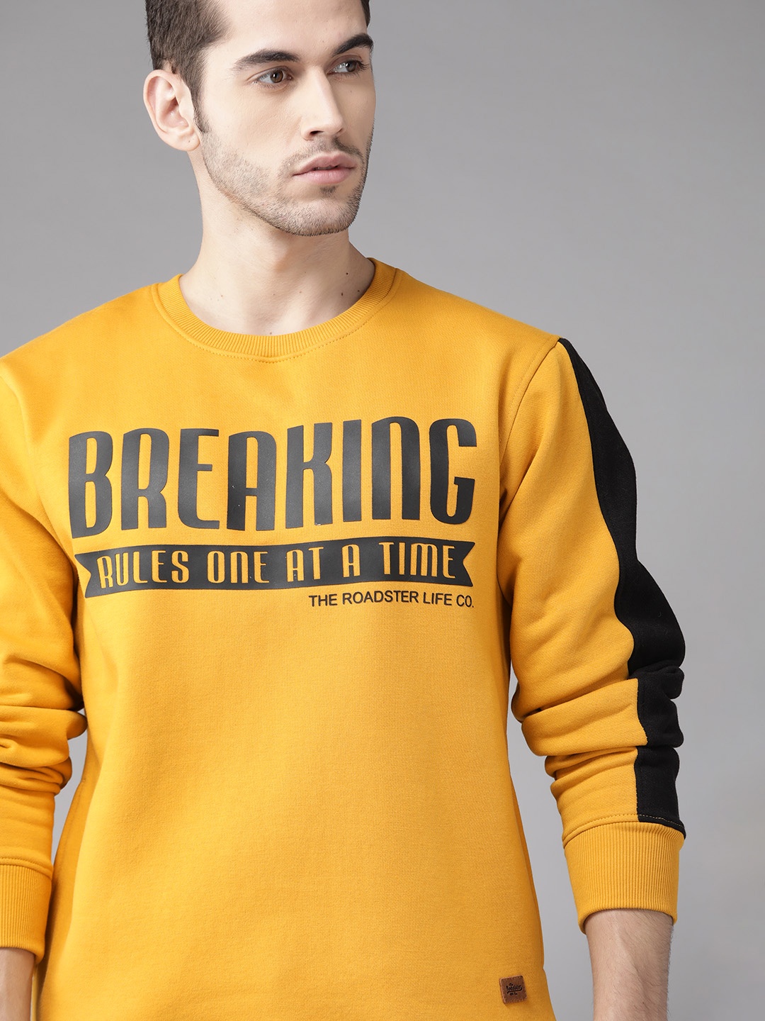

Roadster Men Mustard Yellow & Black Typography Printed Sweatshirt