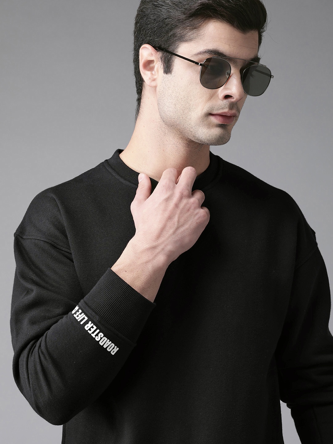 

Roadster Men Black Solid Sweatshirt