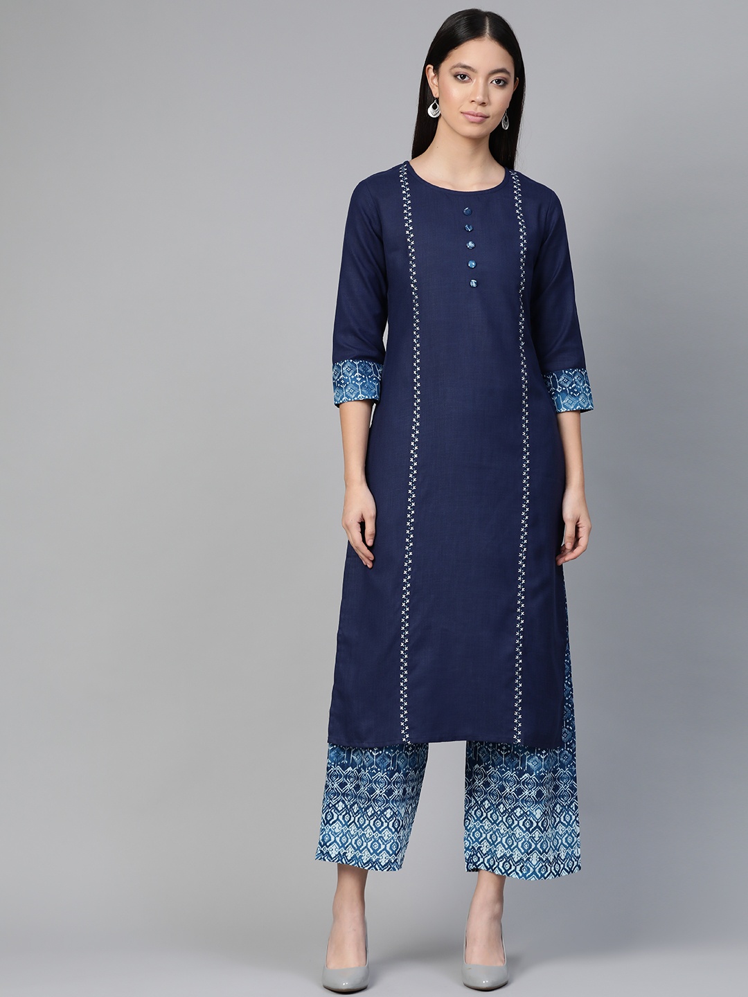 

Indo Era Women Navy Blue & White Solid Kurta with Palazzos