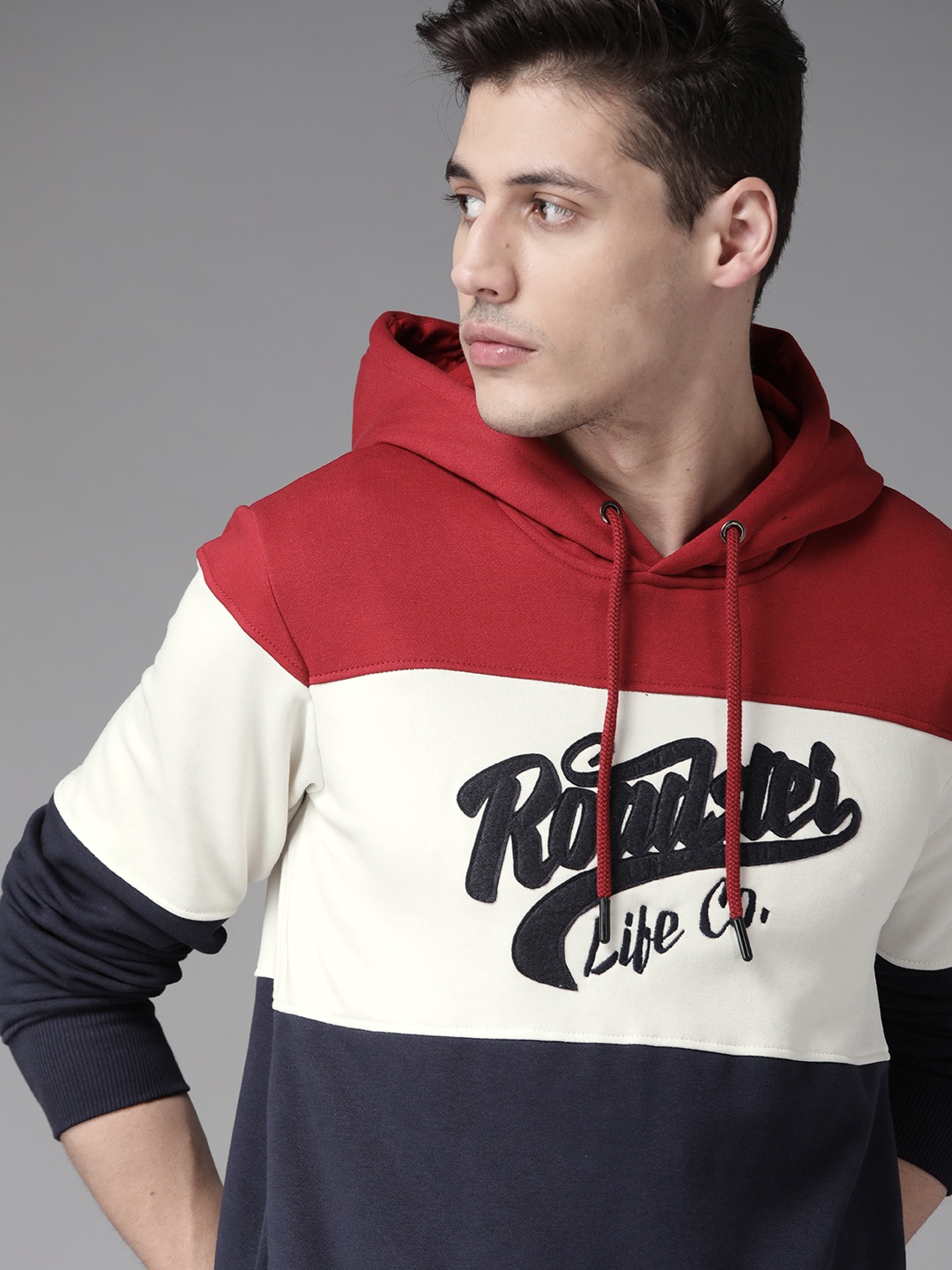 

Roadster Men Navy Blue & Maroon Colourblocked Hooded Sweatshirt