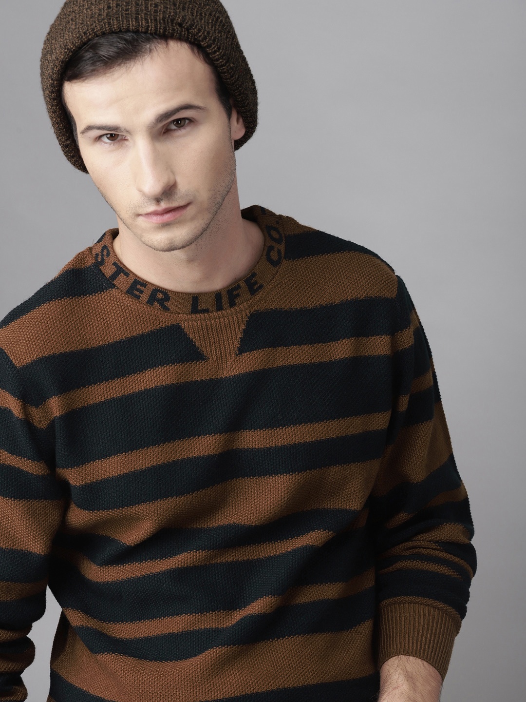 

Roadster Men Brown & Navy Striped Sweater