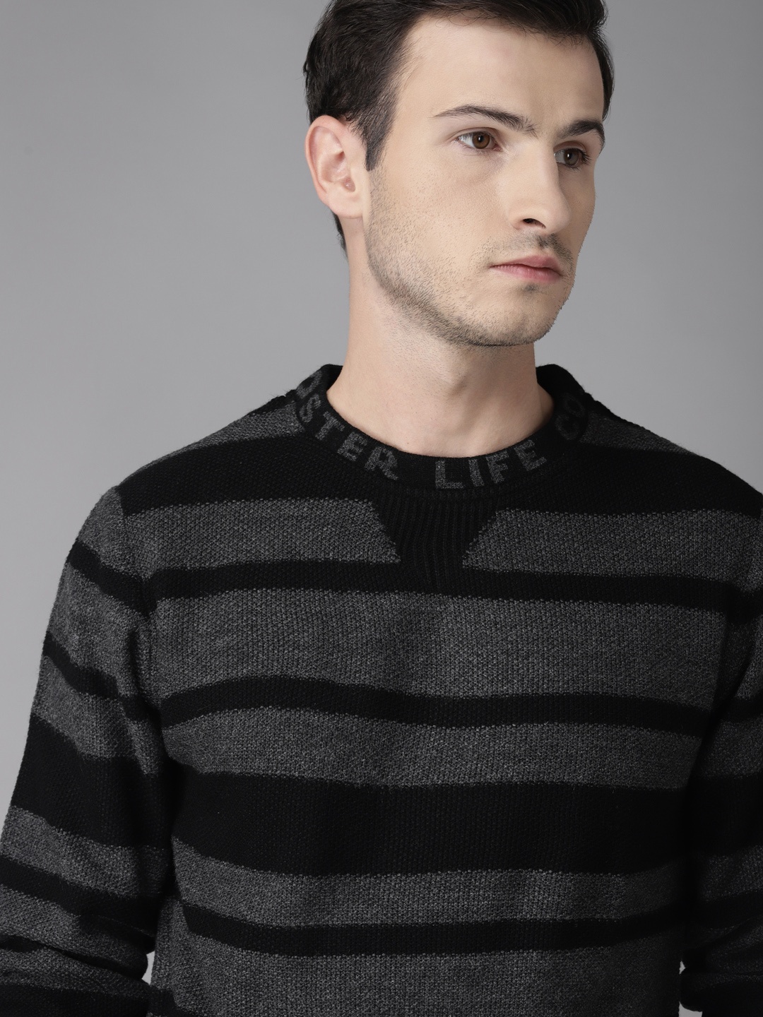 

Roadster Men Charcoal Grey & Black Striped Sweater