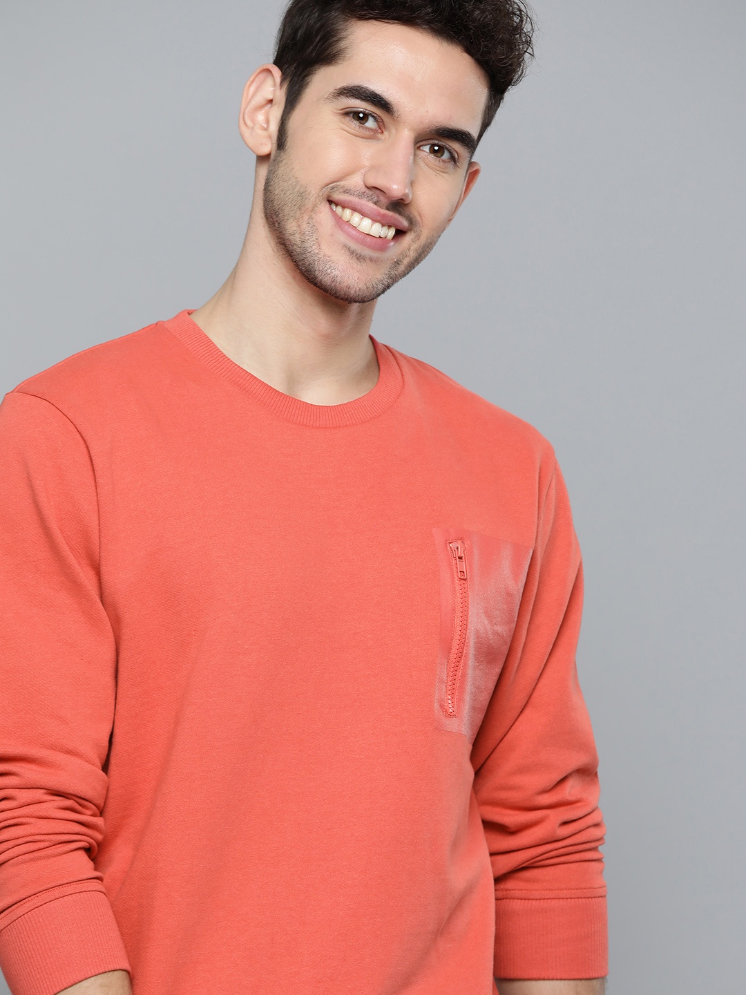 

Mast & Harbour Men Coral Red Solid Sweatshirt