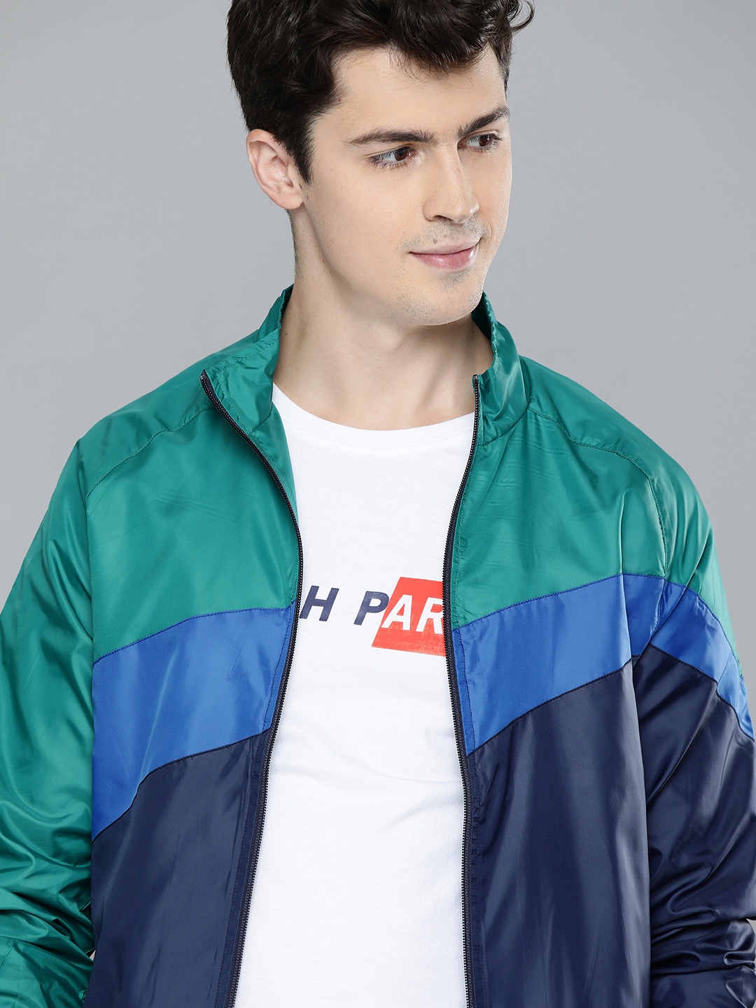 

Mast & Harbour Men Navy Blue & Green Colourblocked Lightweight Sporty Jacket