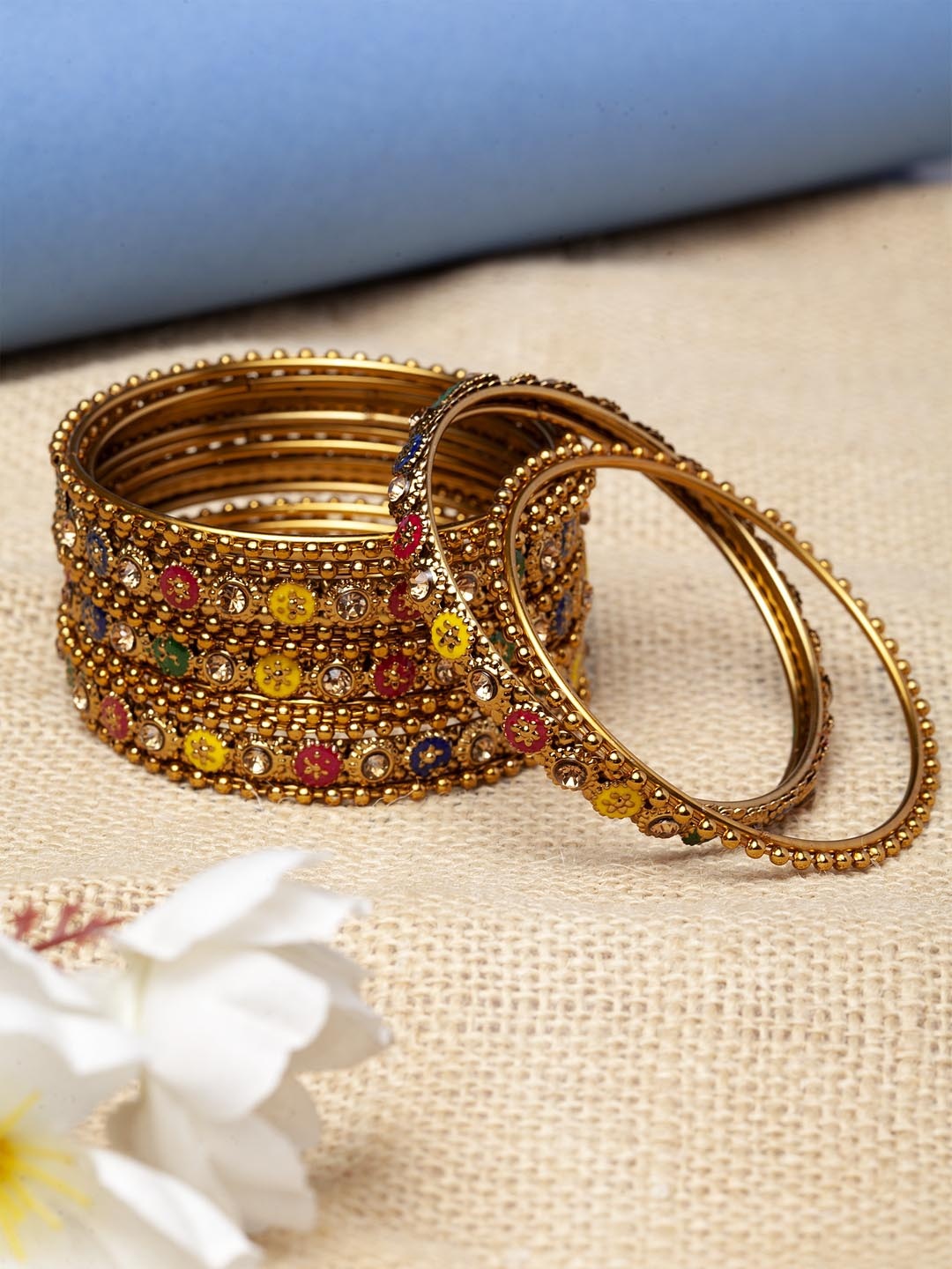 

Shining Diva Set Of 12 Gold-Plated Red & Yellow Enamelled Stone-Studded Bangles