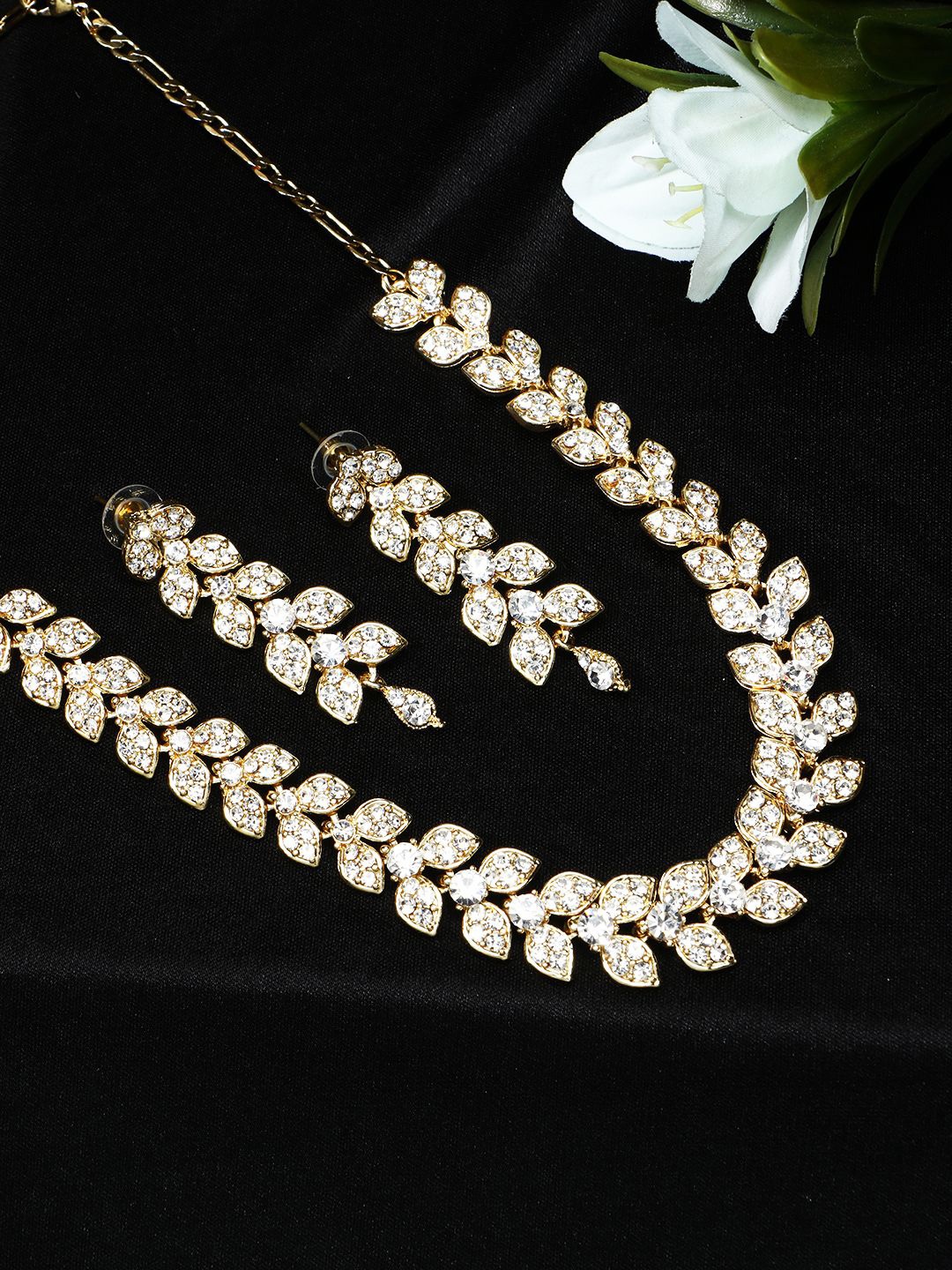 

ANIKAS CREATION Gold-Plated White AD-Studded Leaf Shaped Jewellery Set