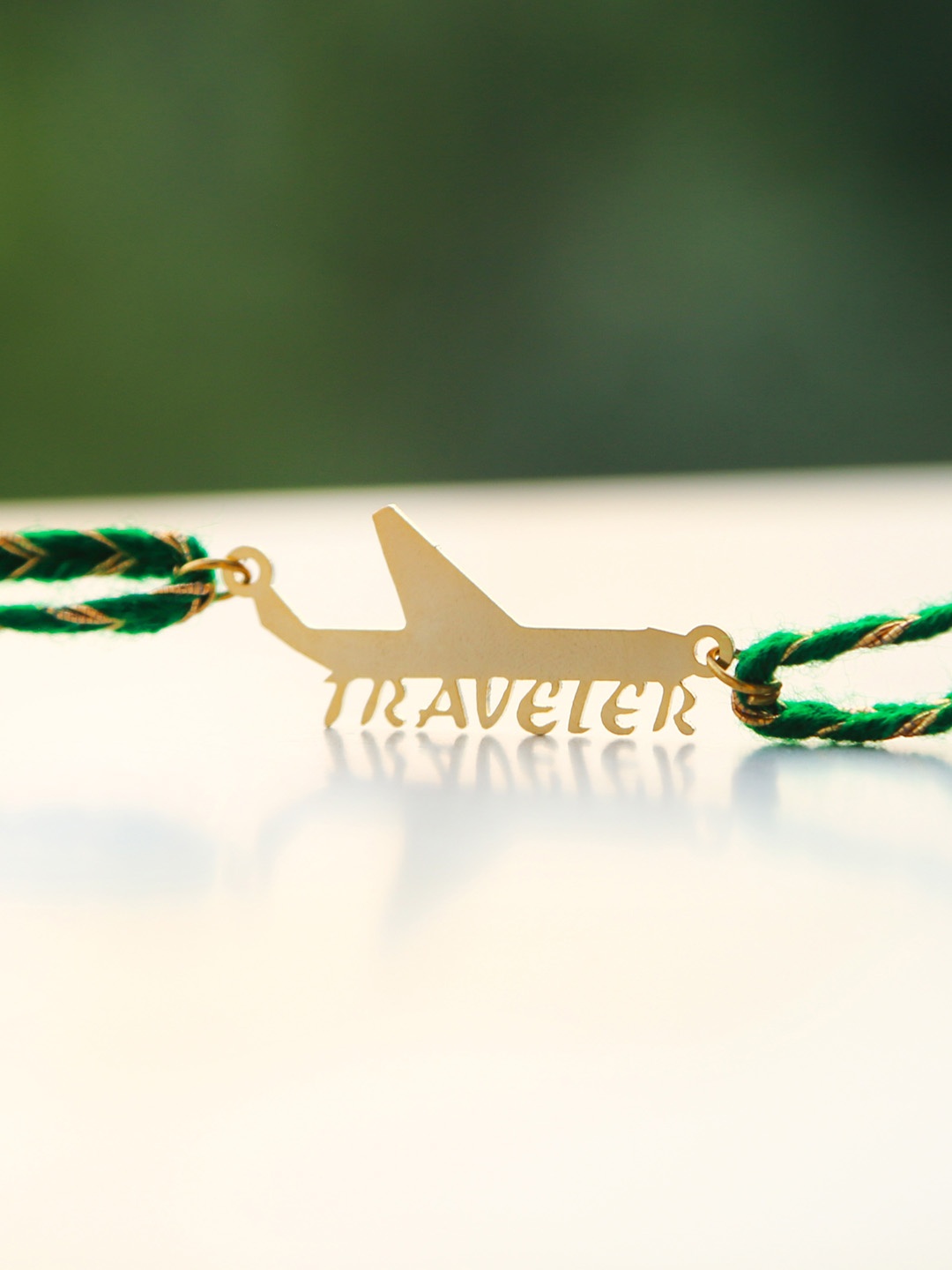

Bigsmall Gold-Toned Traveler Bhai Rakhi