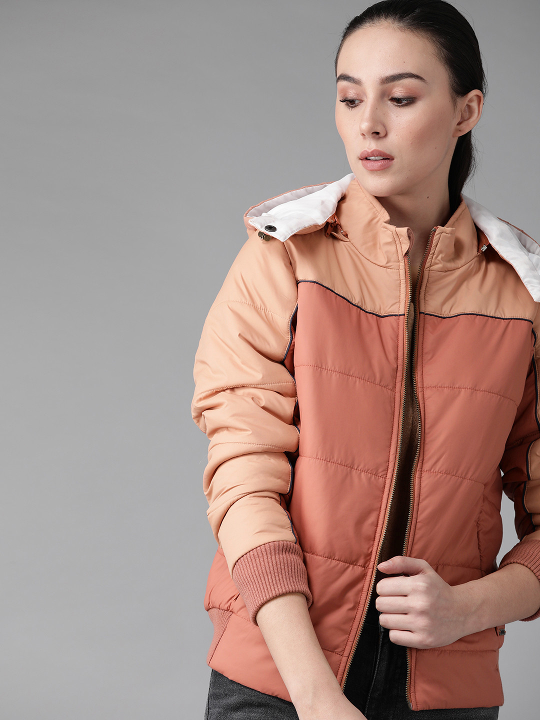 

Roadster Women Coral Pink and Peach-Coloured Colourblocked Hooded Bomber Jacket
