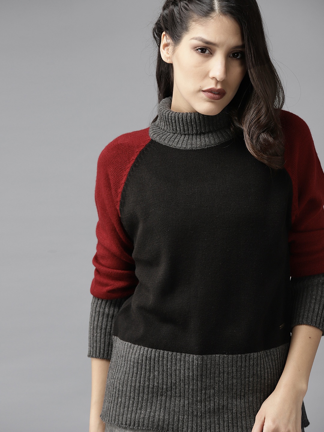 

Roadster Women Black & Maroon Solid Sweater
