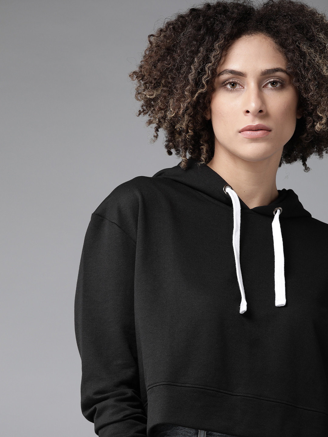 

Roadster Women Black Solid Hooded Sweatshirt