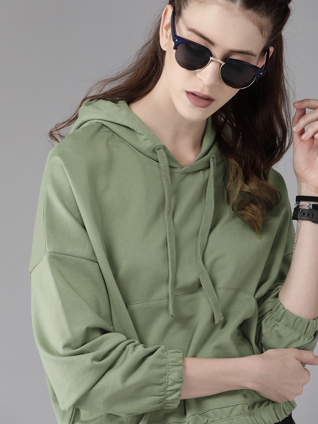 

Roadster Women Olive Green Solid Hooded Oversized Sweatshirt