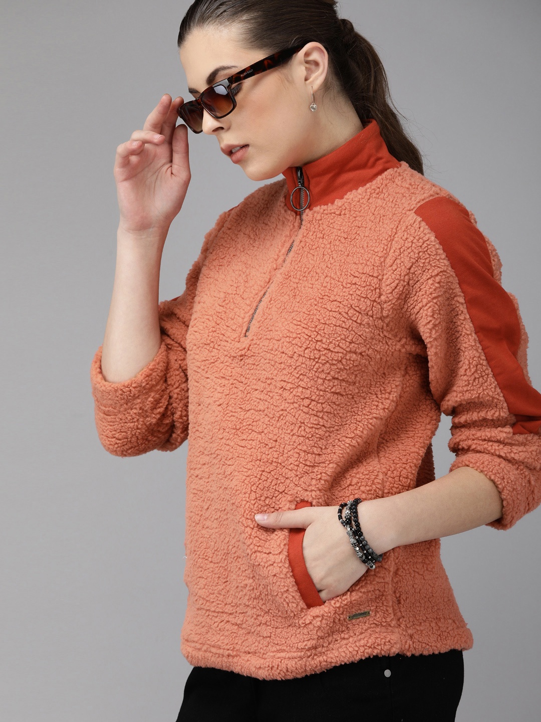 

Roadster Women Orange Solid Fleece Pullover Sweatshirt