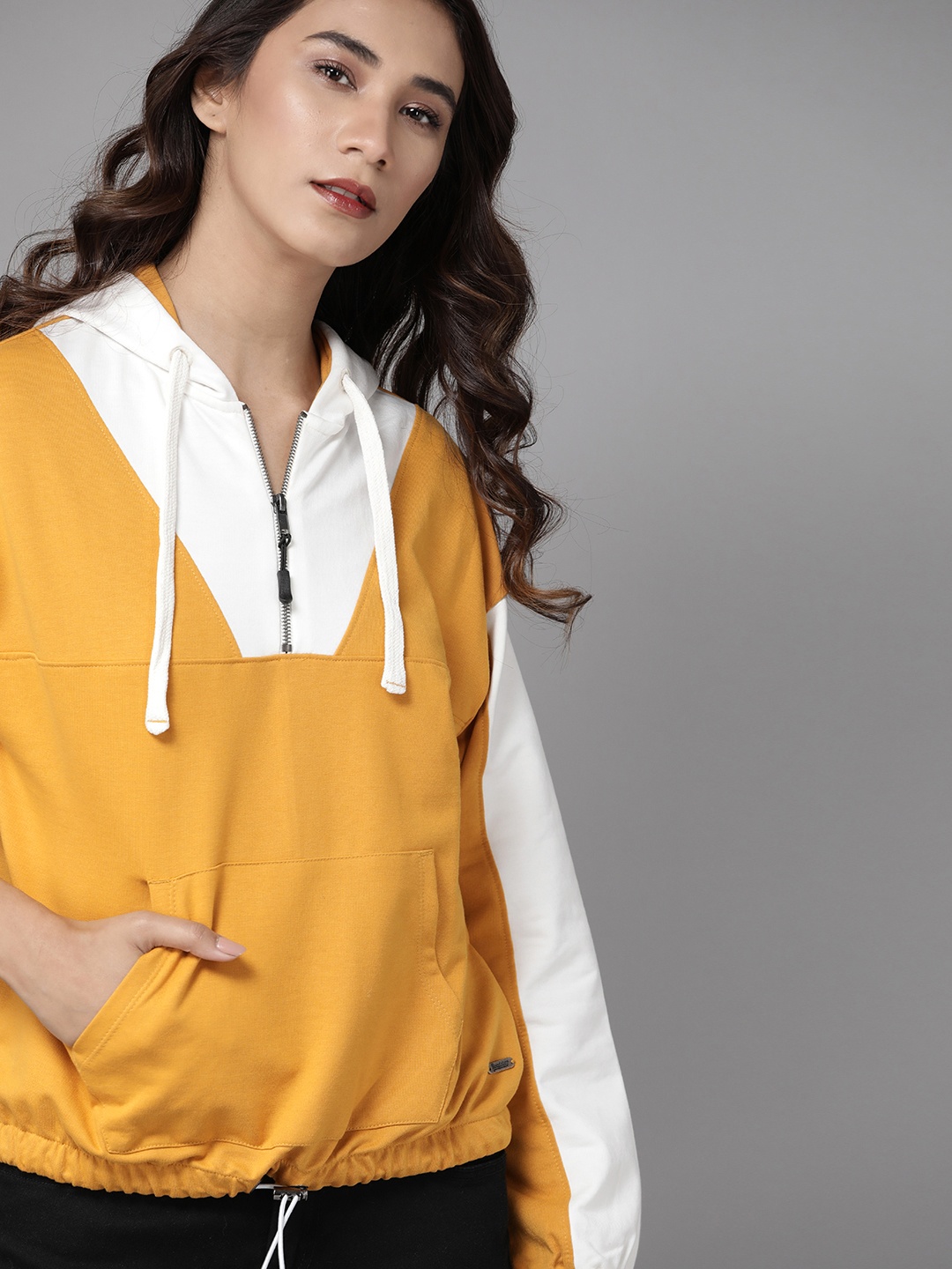 

Roadster Women Mustard Yellow & White Colourblocked Hooded Sweatshirt