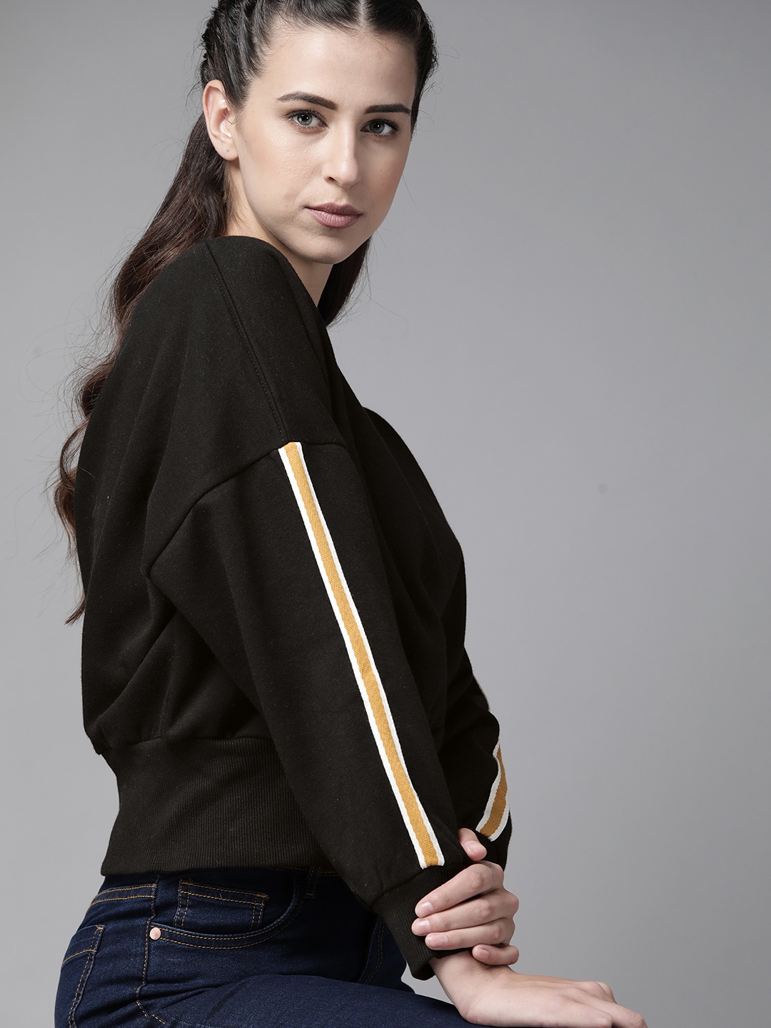 

Roadster Women Black Solid Sweatshirt