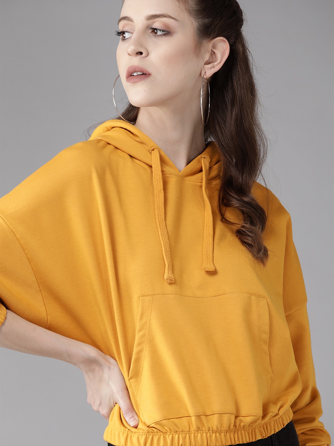 

Roadster Women Mustard Yellow Solid Hooded Sweatshirt