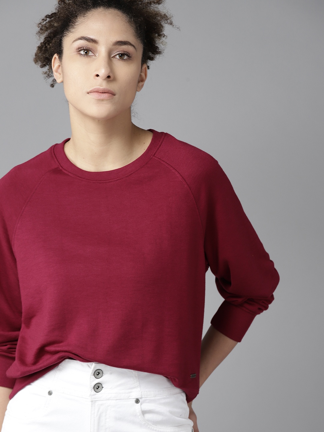 

Roadster Women Maroon Solid Sweatshirt