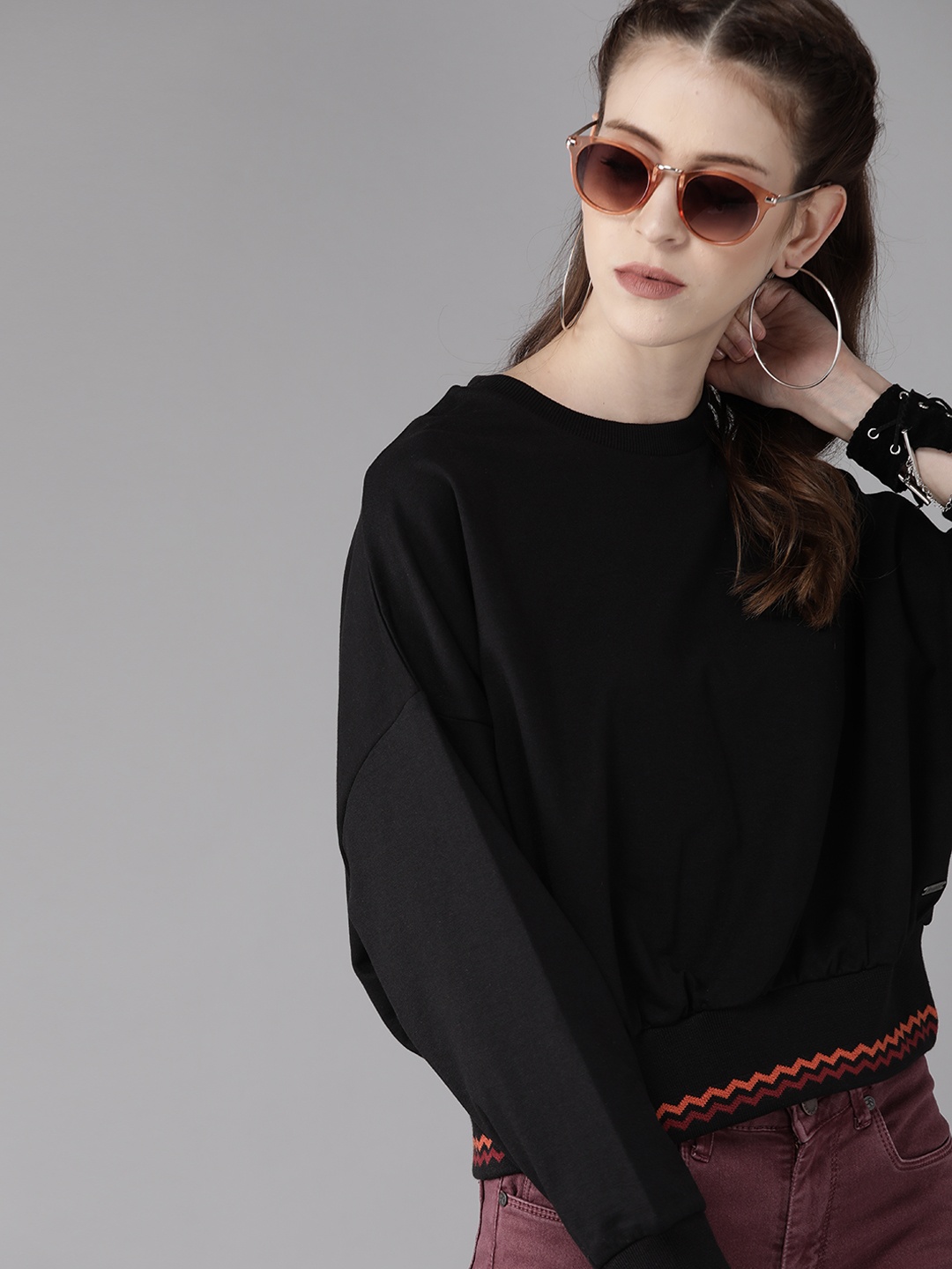 

Roadster Women Black Solid Sweatshirt