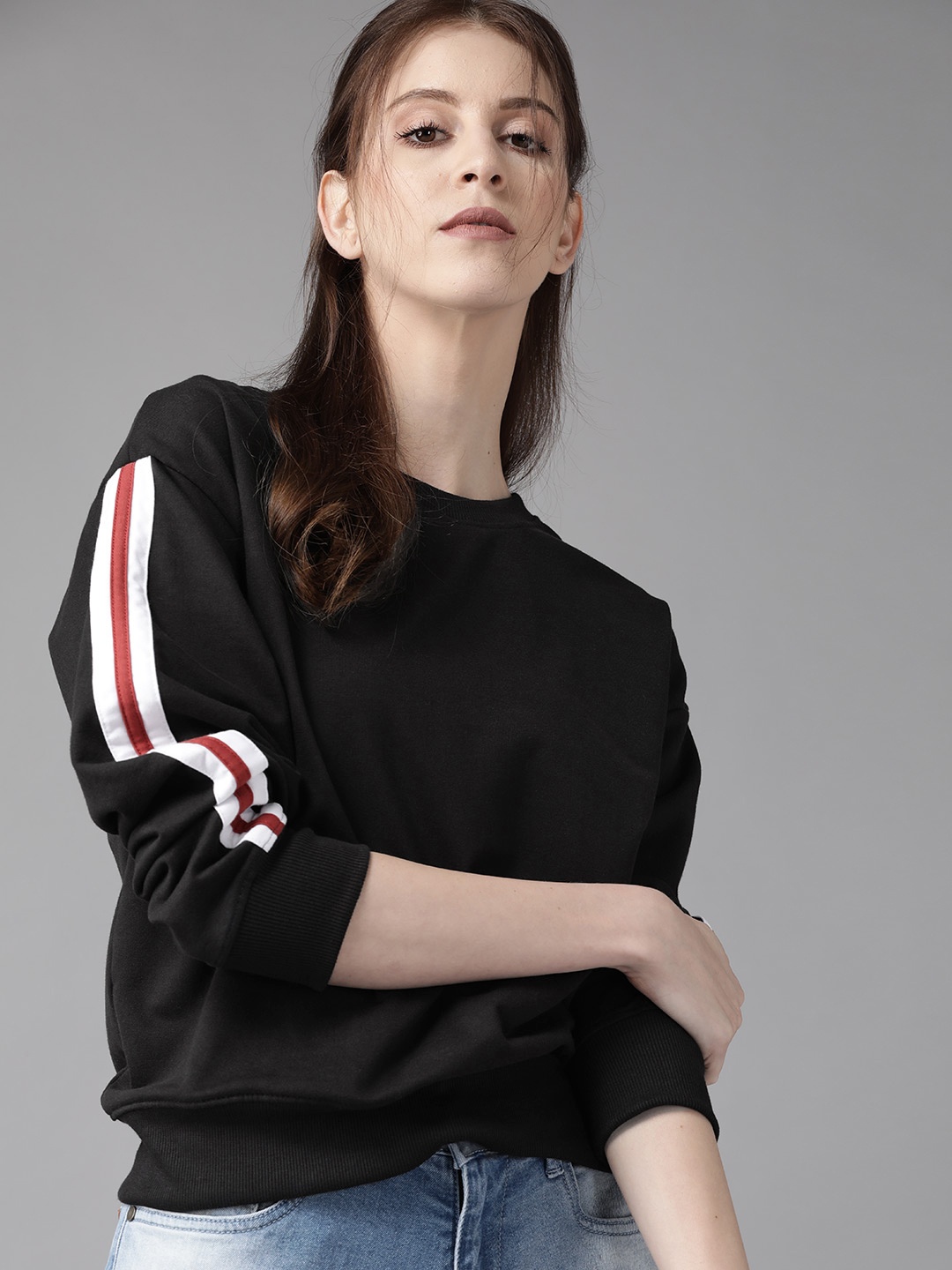 

Roadster Women Black Solid Sweatshirt