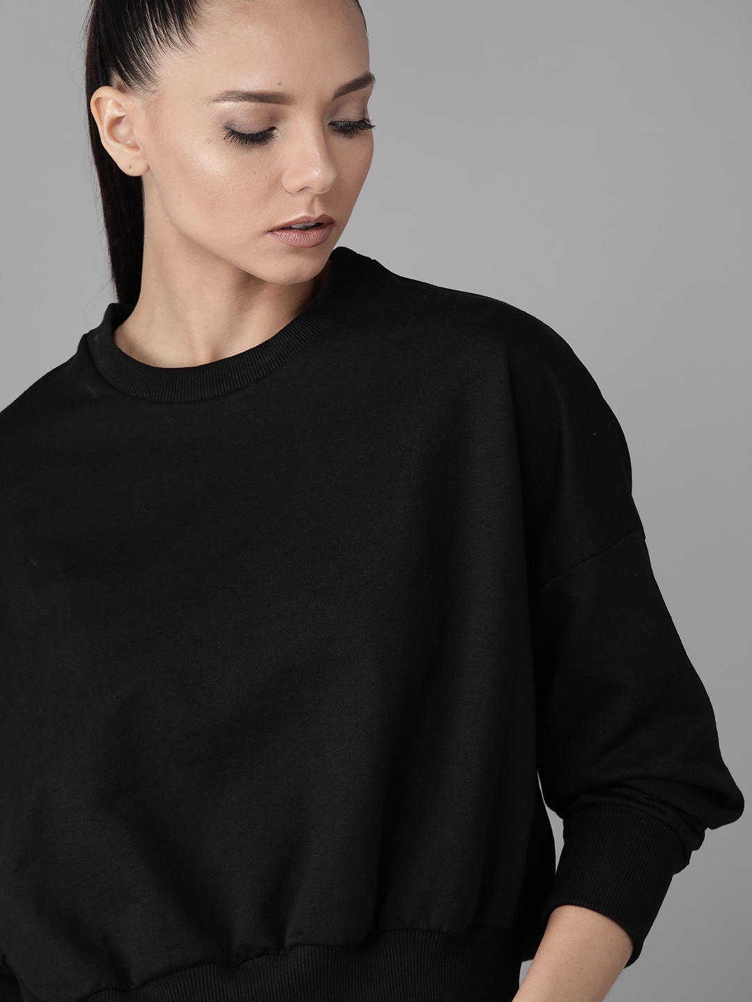 

Roadster Women Black Solid Sweatshirt