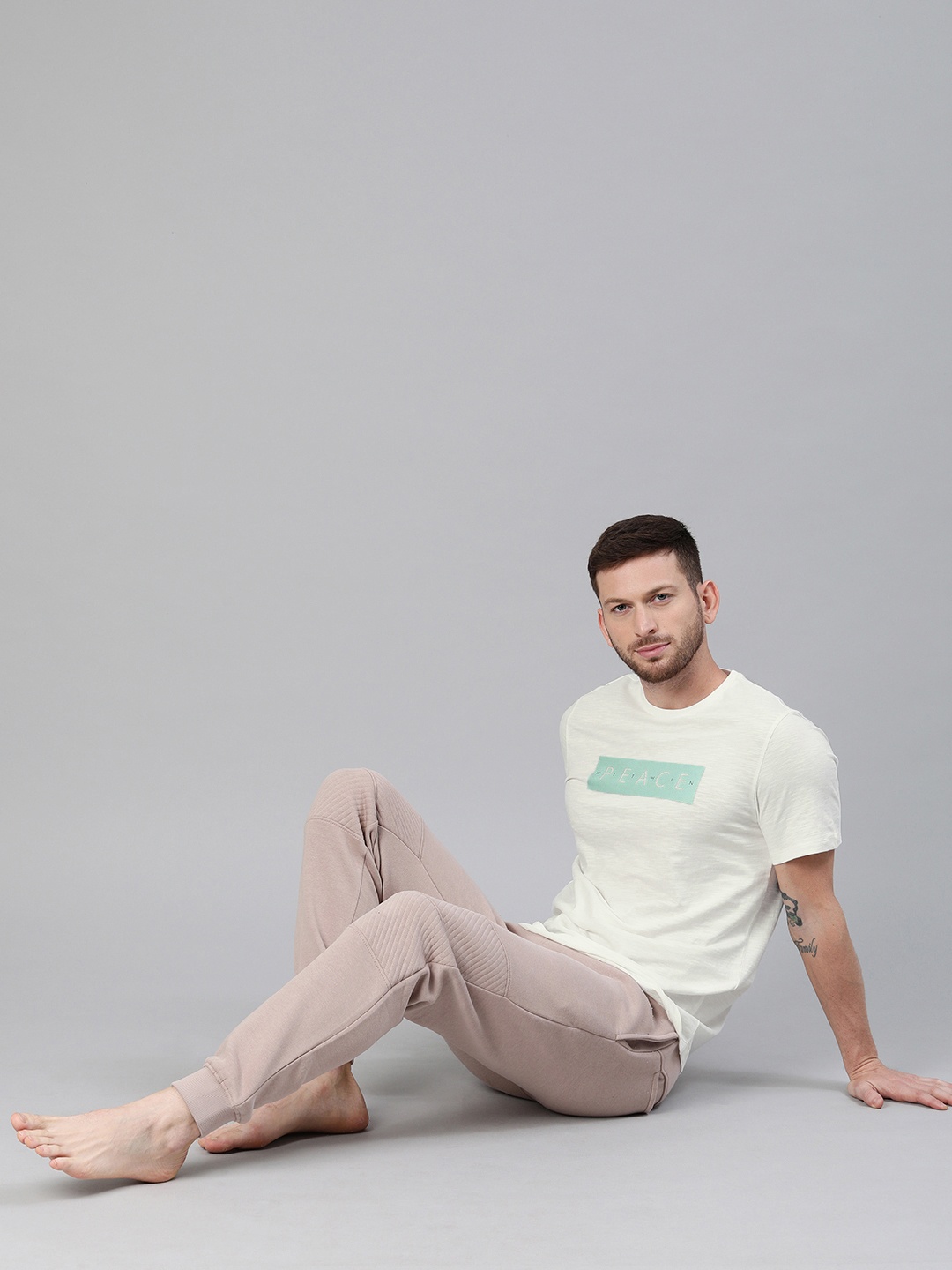 

HRX by Hrithik Roshan Men Off-White Solid Bio-Wash Yoga Pure Cotton T-shirt