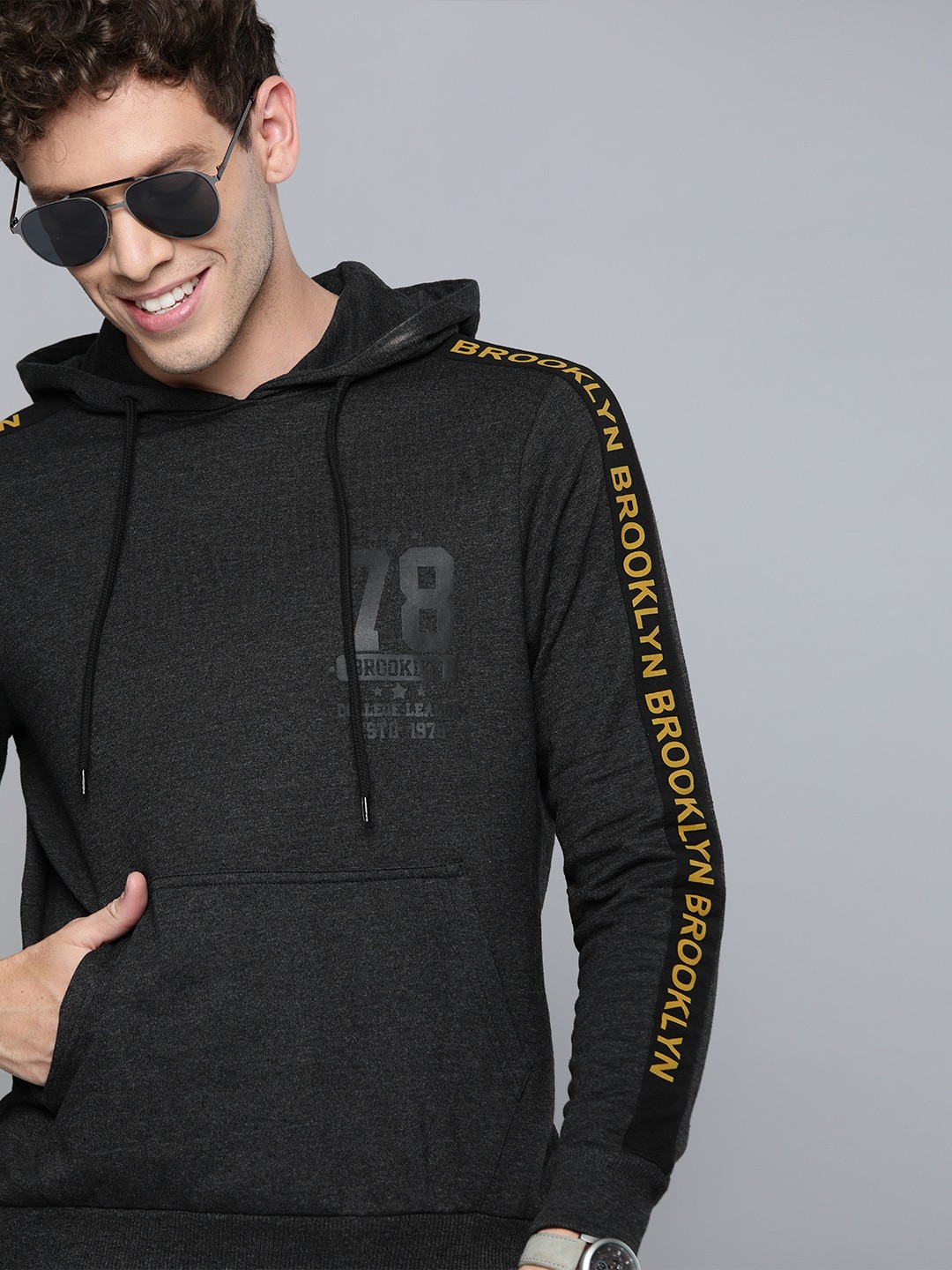 

HERE&NOW Men Charcoal Grey Solid Hooded Sweatshirt with Printed Sleeve