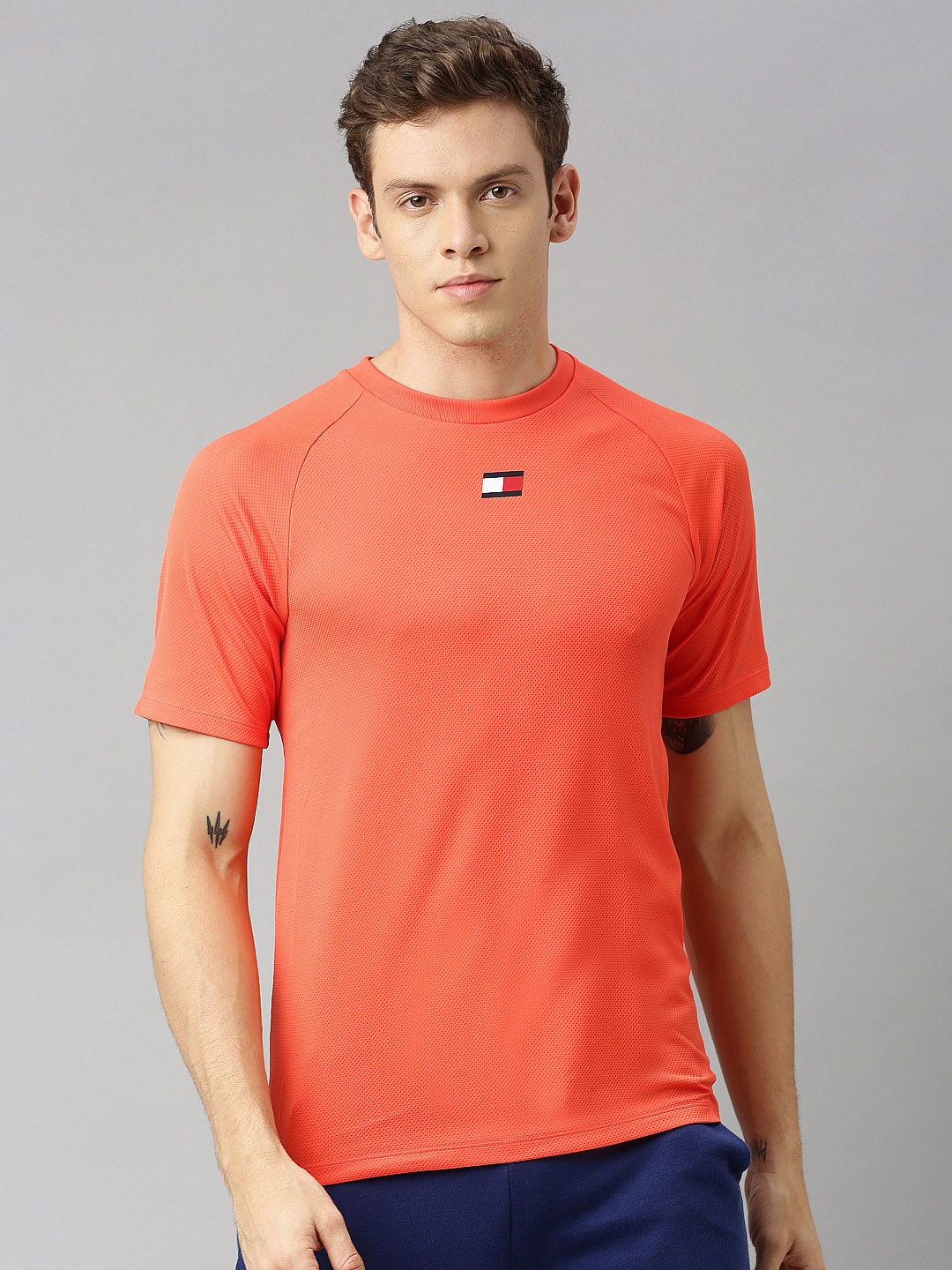 

Tommy Hilfiger Men Orange Self Design Round Neck Training T-shirt