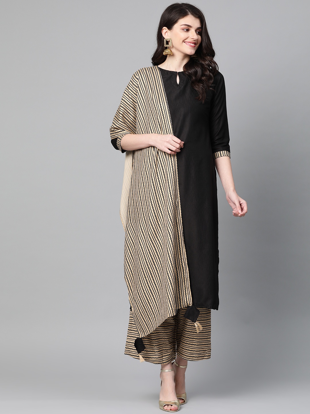 

Indo Era Women Black & Golden Solid Kurta with Palazzos & Dupatta