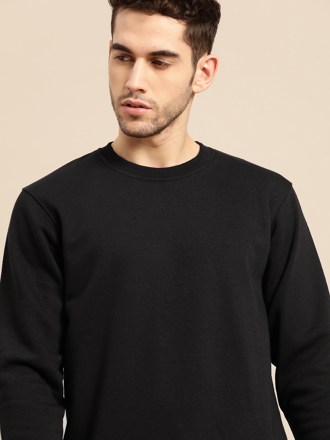 

ether Men Black Solid Sweatshirt