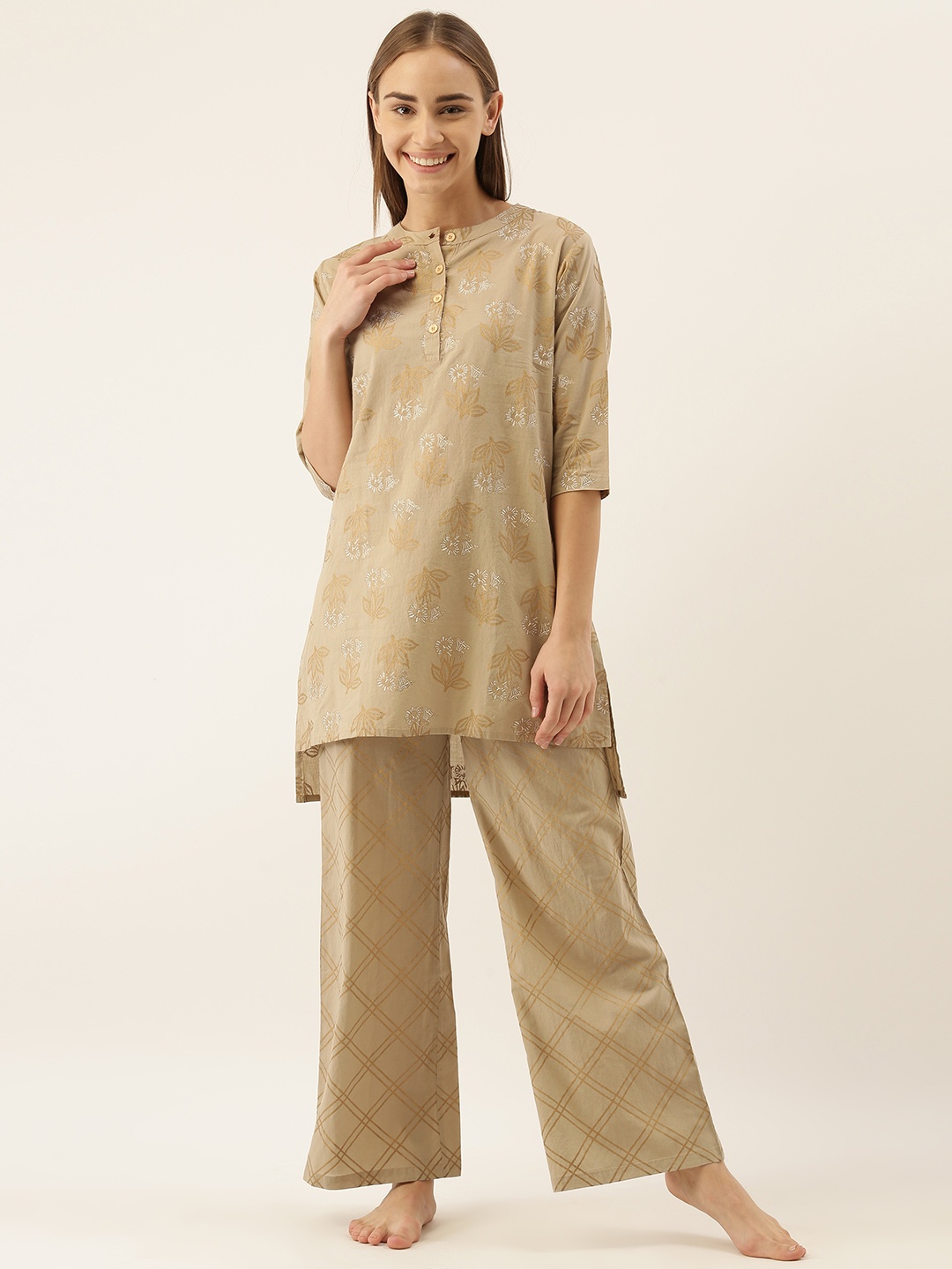 

Clt.s Women 2 Pc Beige & Golden Printed Night Suit Set