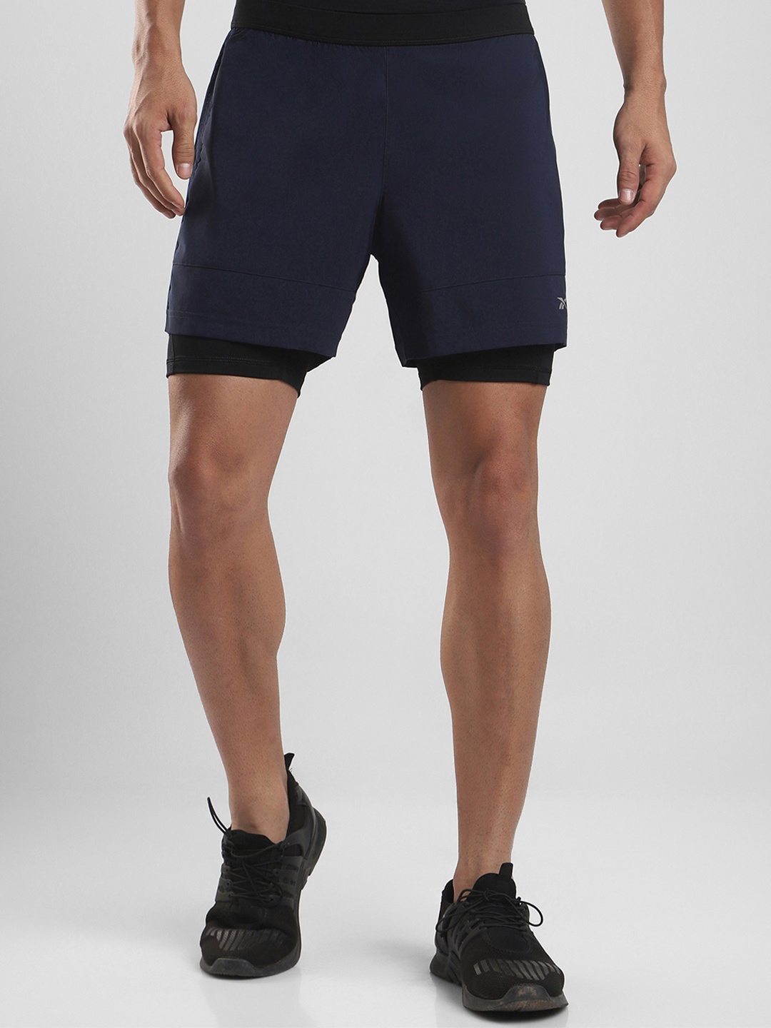 

Reebok Men Navy Solid Running Essentials Two-in-One Shorts, Navy blue