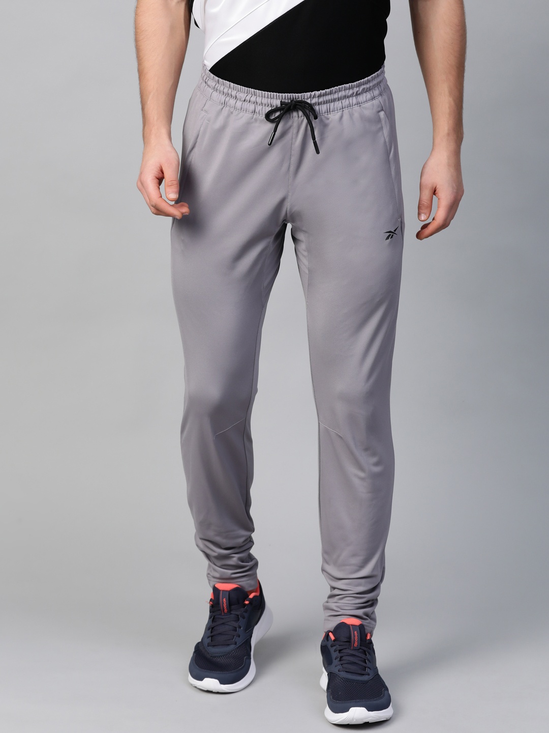 

Reebok Men Grey Solid Training WOR Knit Track Pants