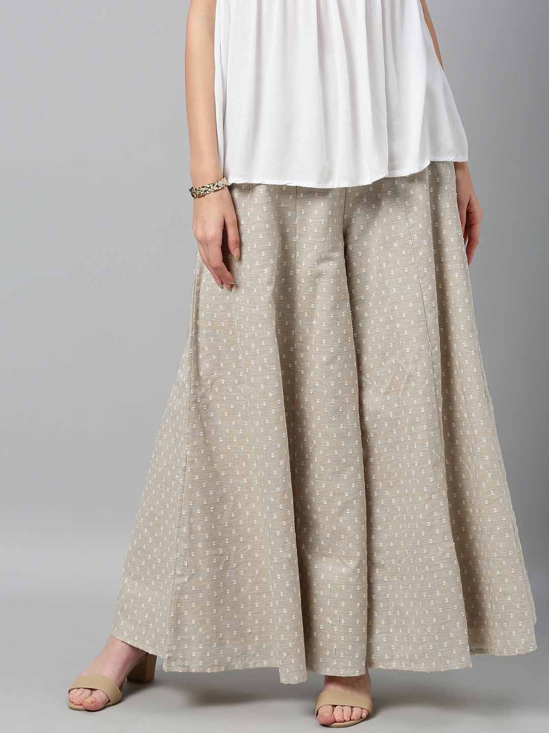 

Global Desi Women Beige Self Design Wide Leg Palazzos