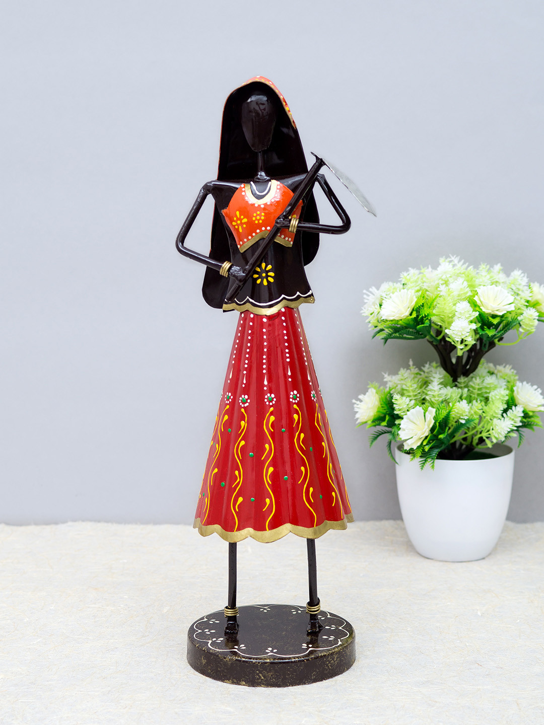 

Golden Peacock Black & Red Handcrafted Metal lady Farmer Decorative Showpiece