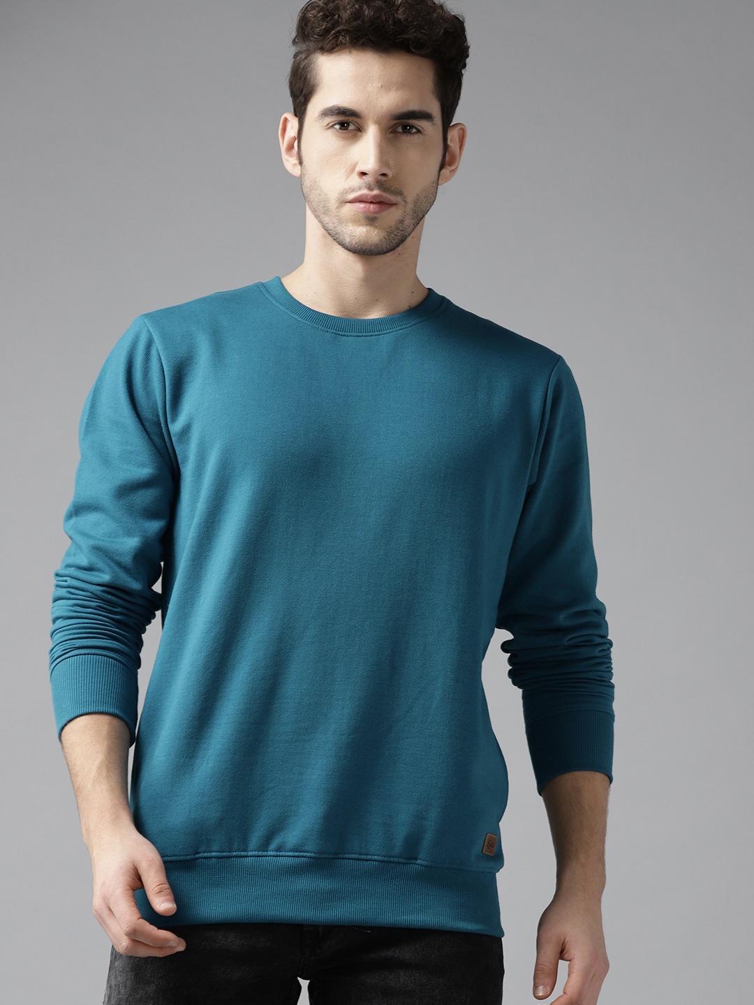 

Roadster Men Teal Blue Solid Sweatshirt